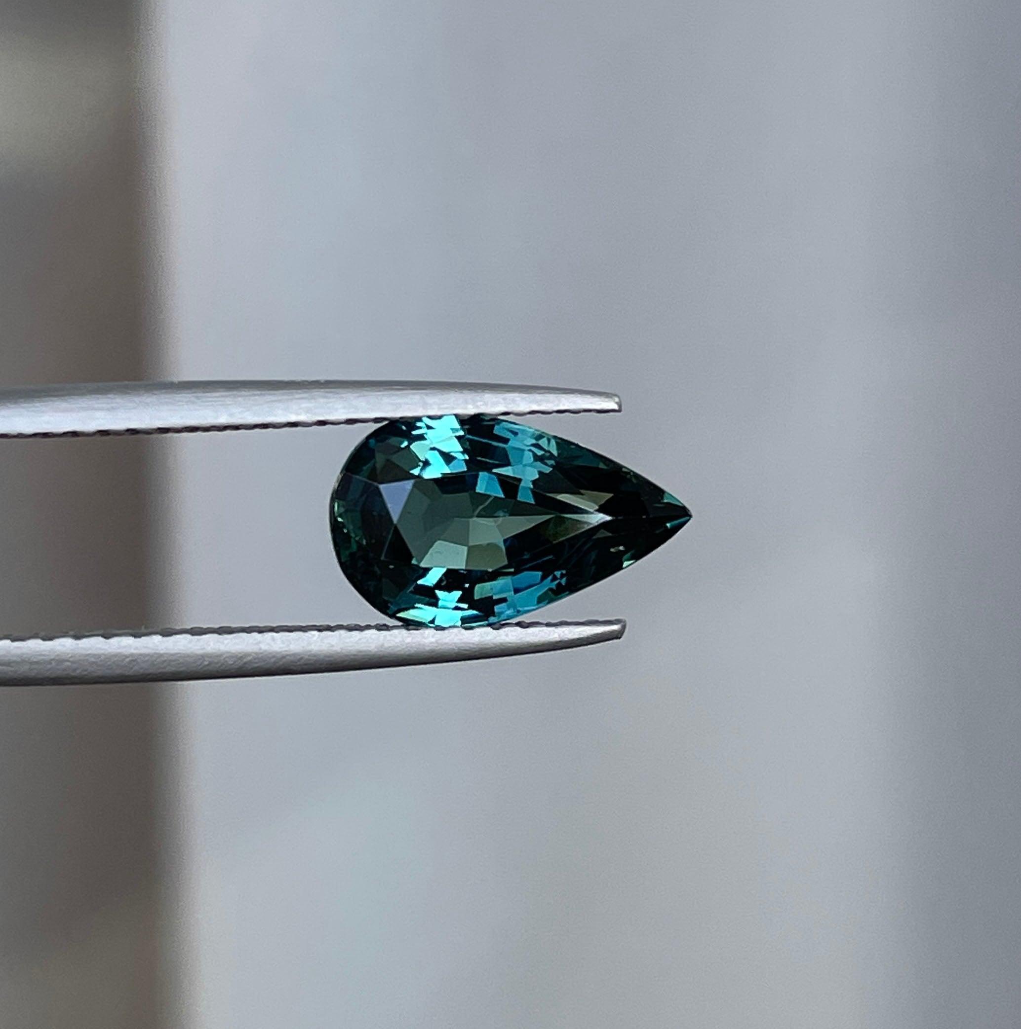 teal blue green parti sapphire pear drop cut gem