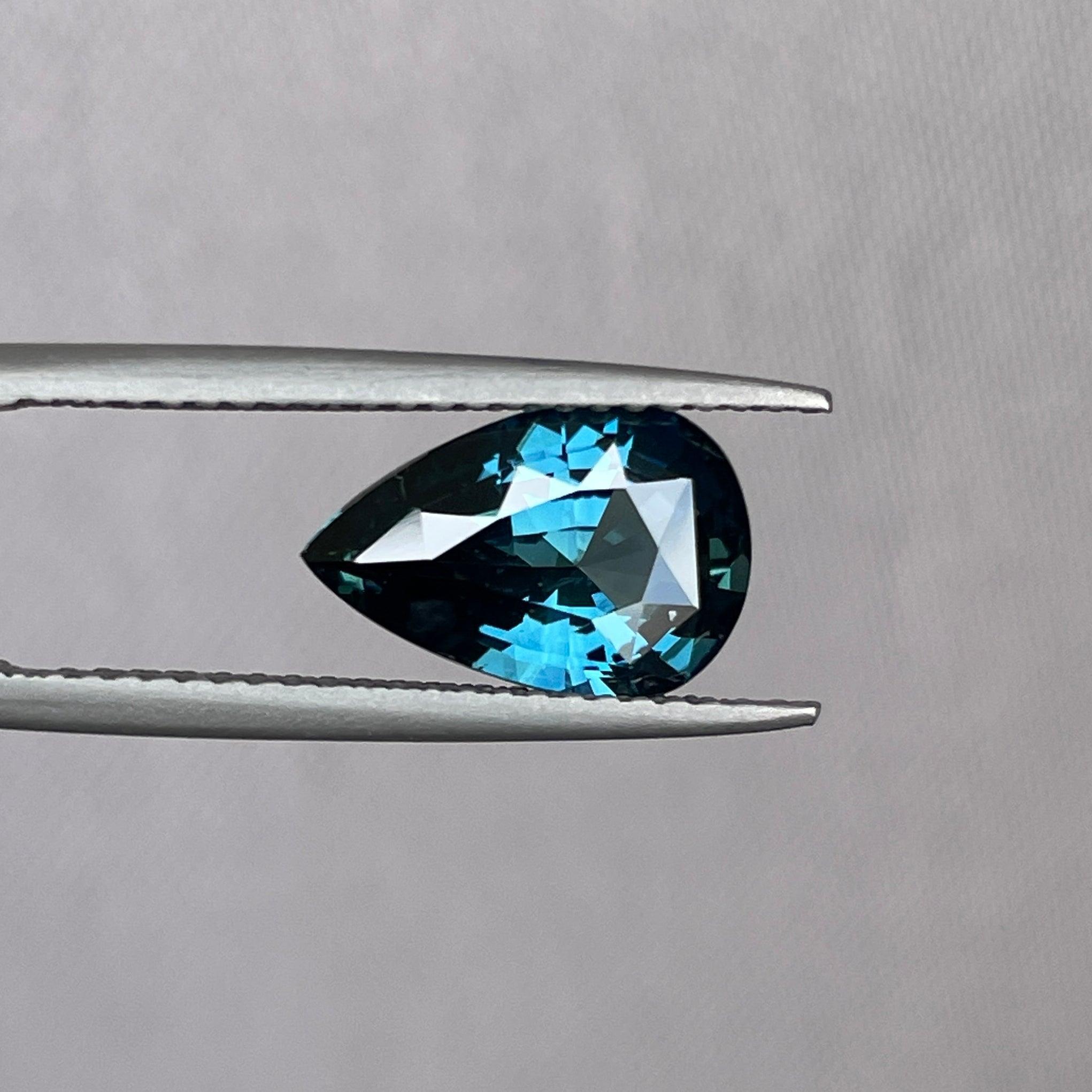 teal blue green parti sapphire pear drop cut gem