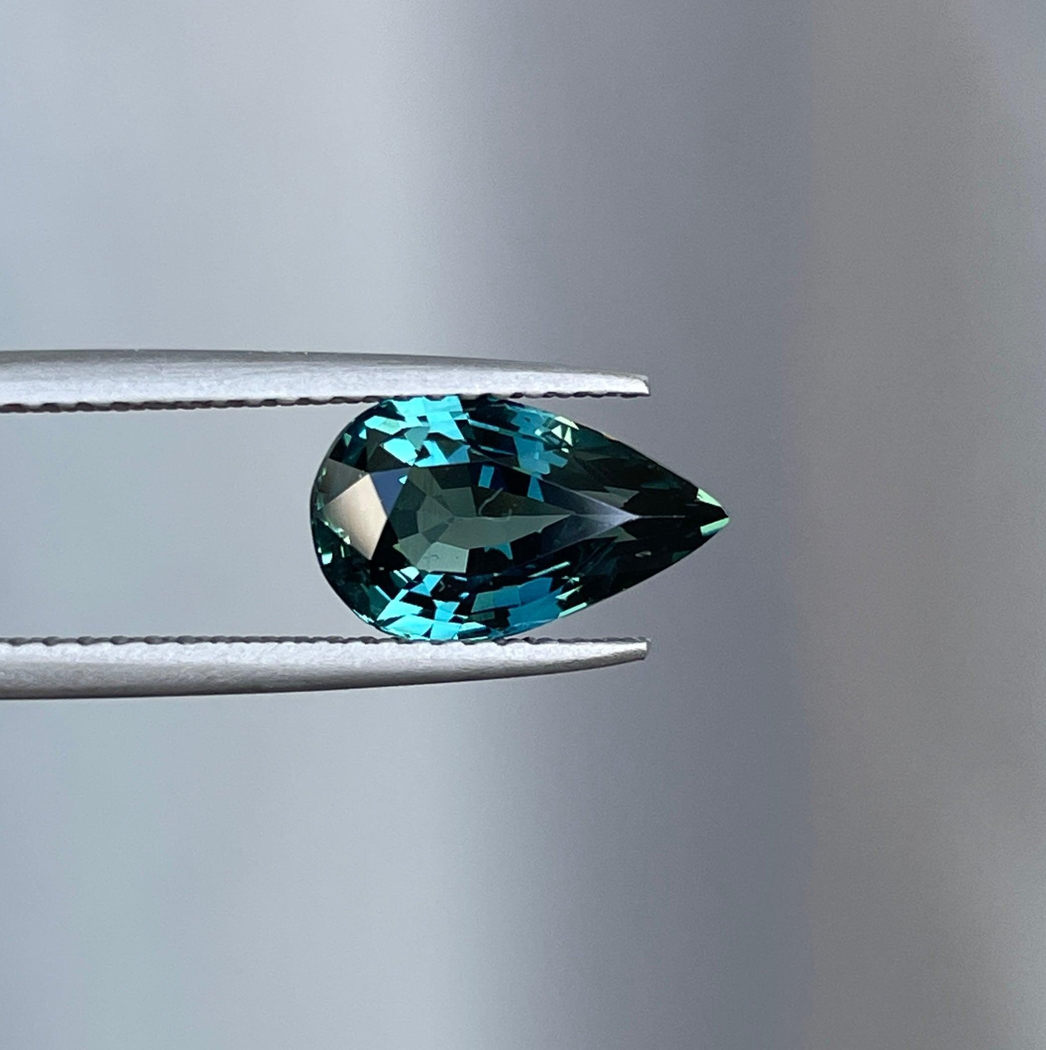 teal blue green parti sapphire pear drop cut gem