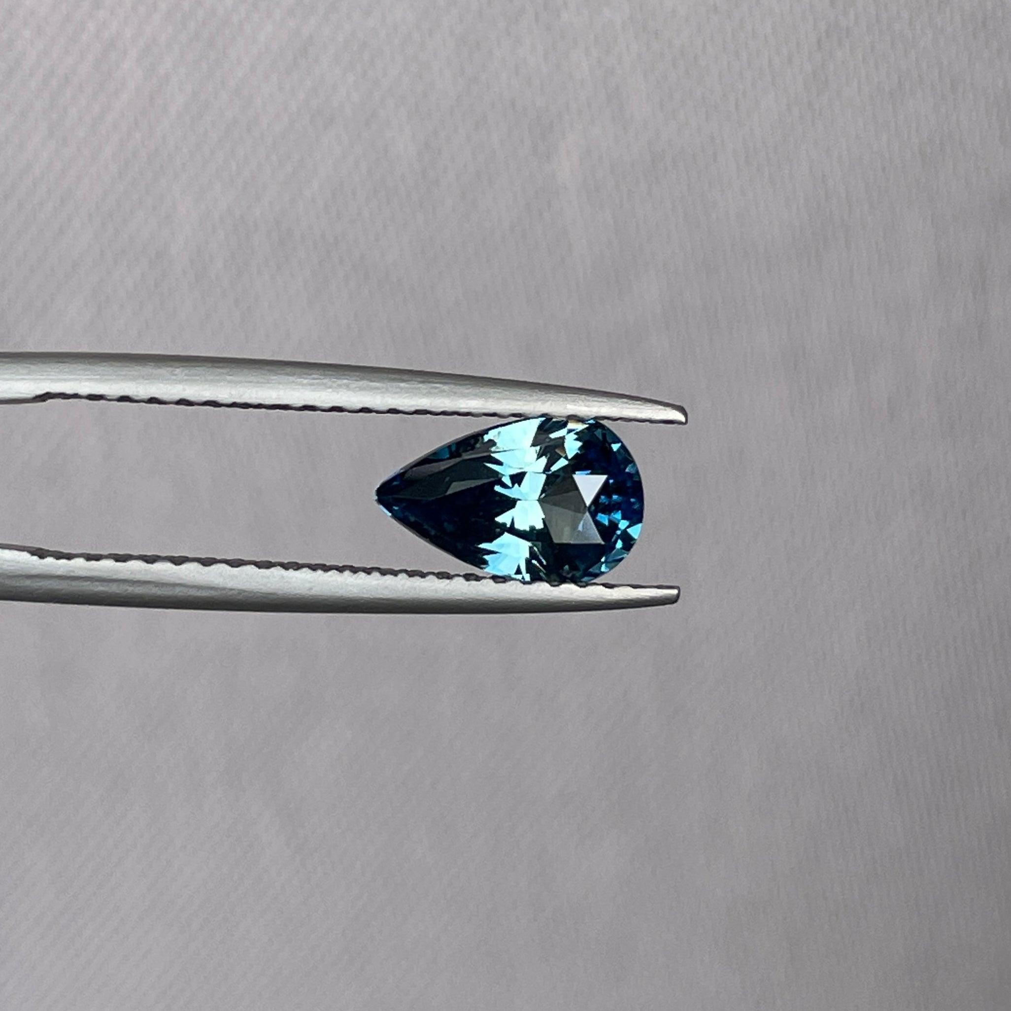 teal blue green parti sapphire pear drop cut gem