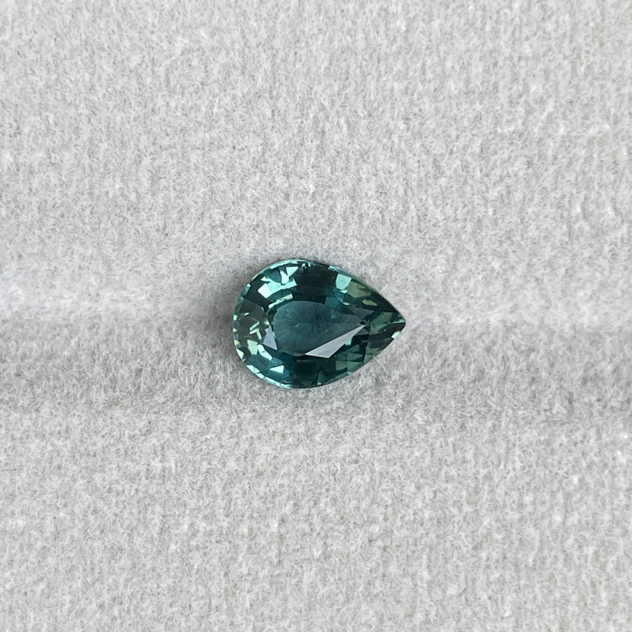 teal blue green parti sapphire pear drop cut gem