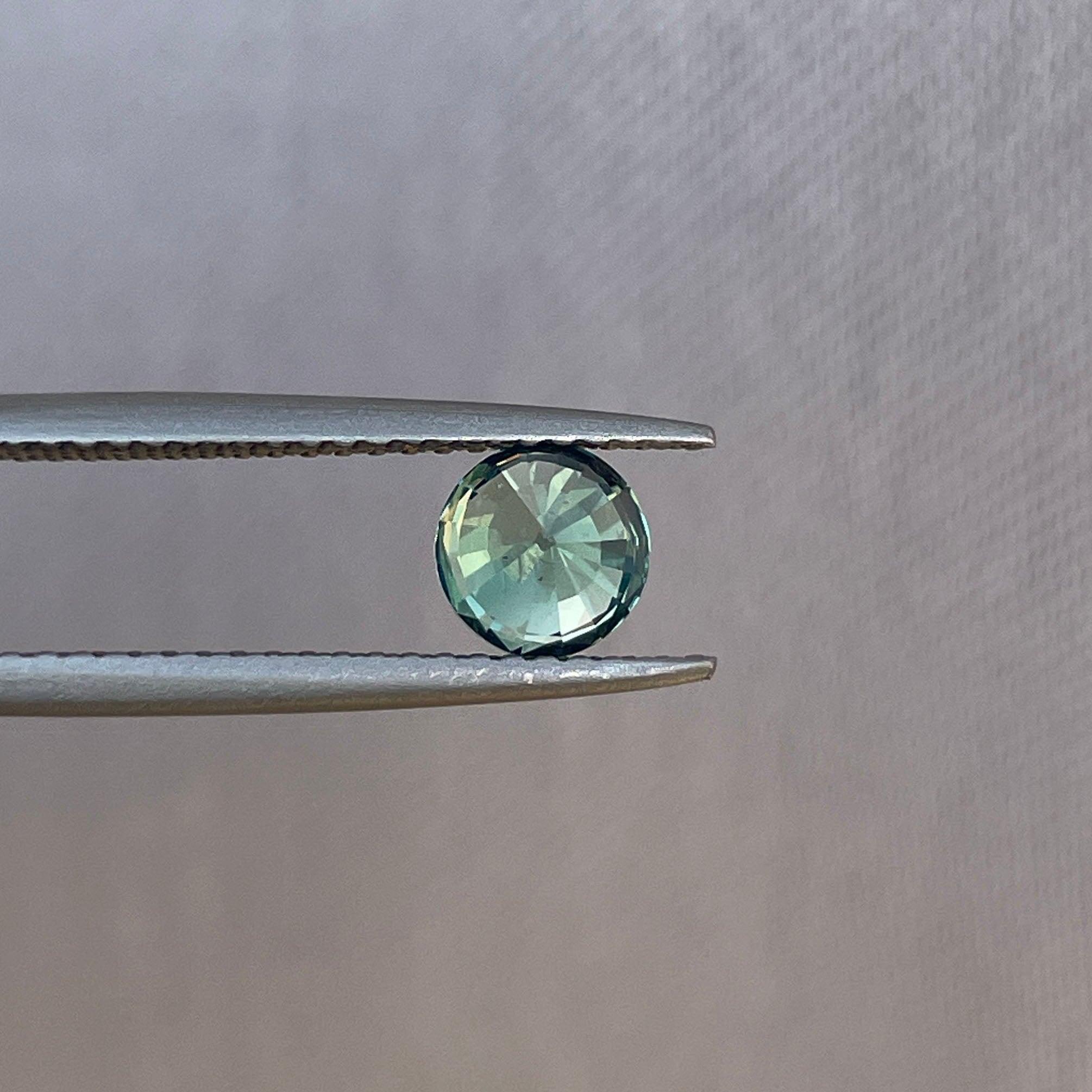 teal blue green parti sapphire round cut gem