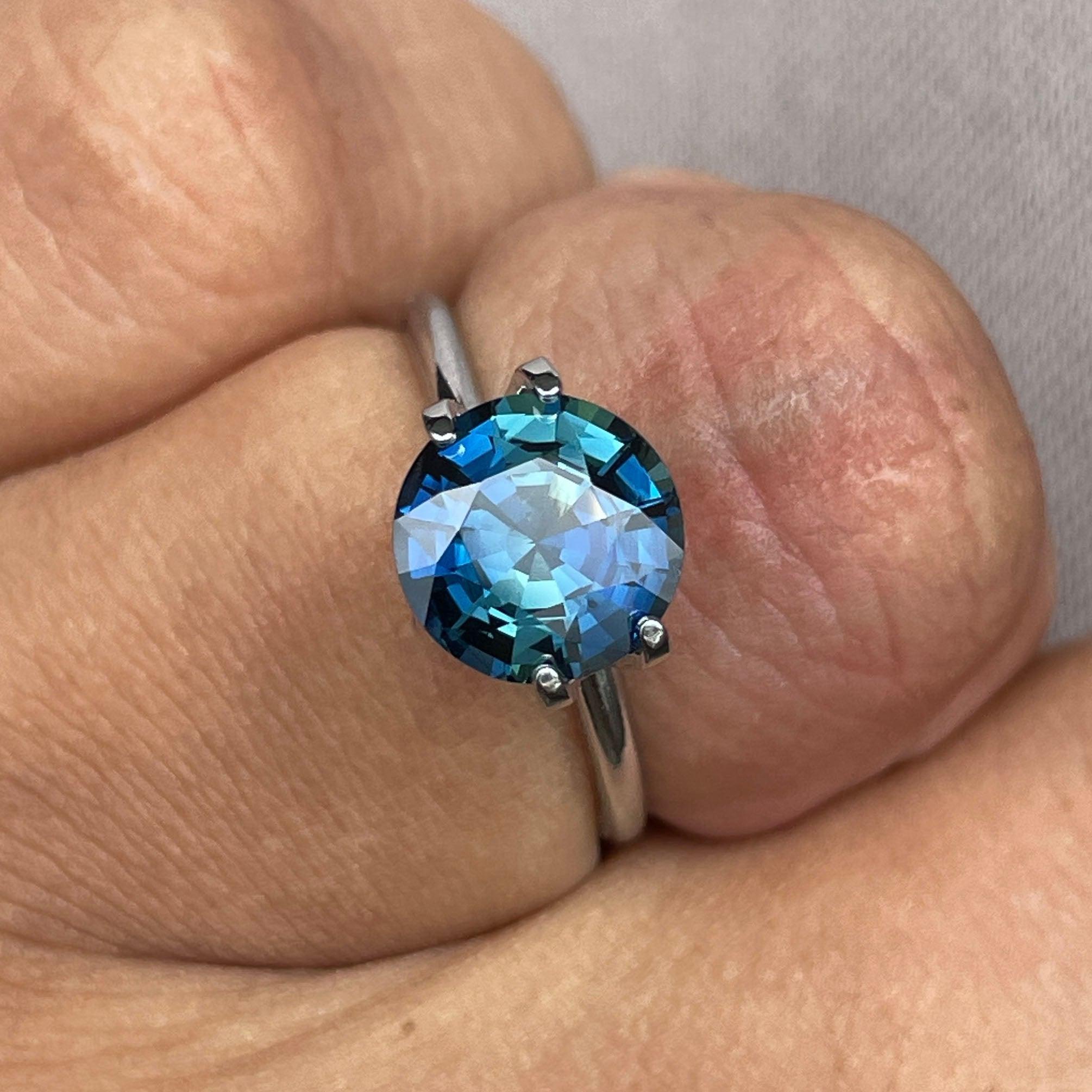 teal blue green parti sapphire round cut gem