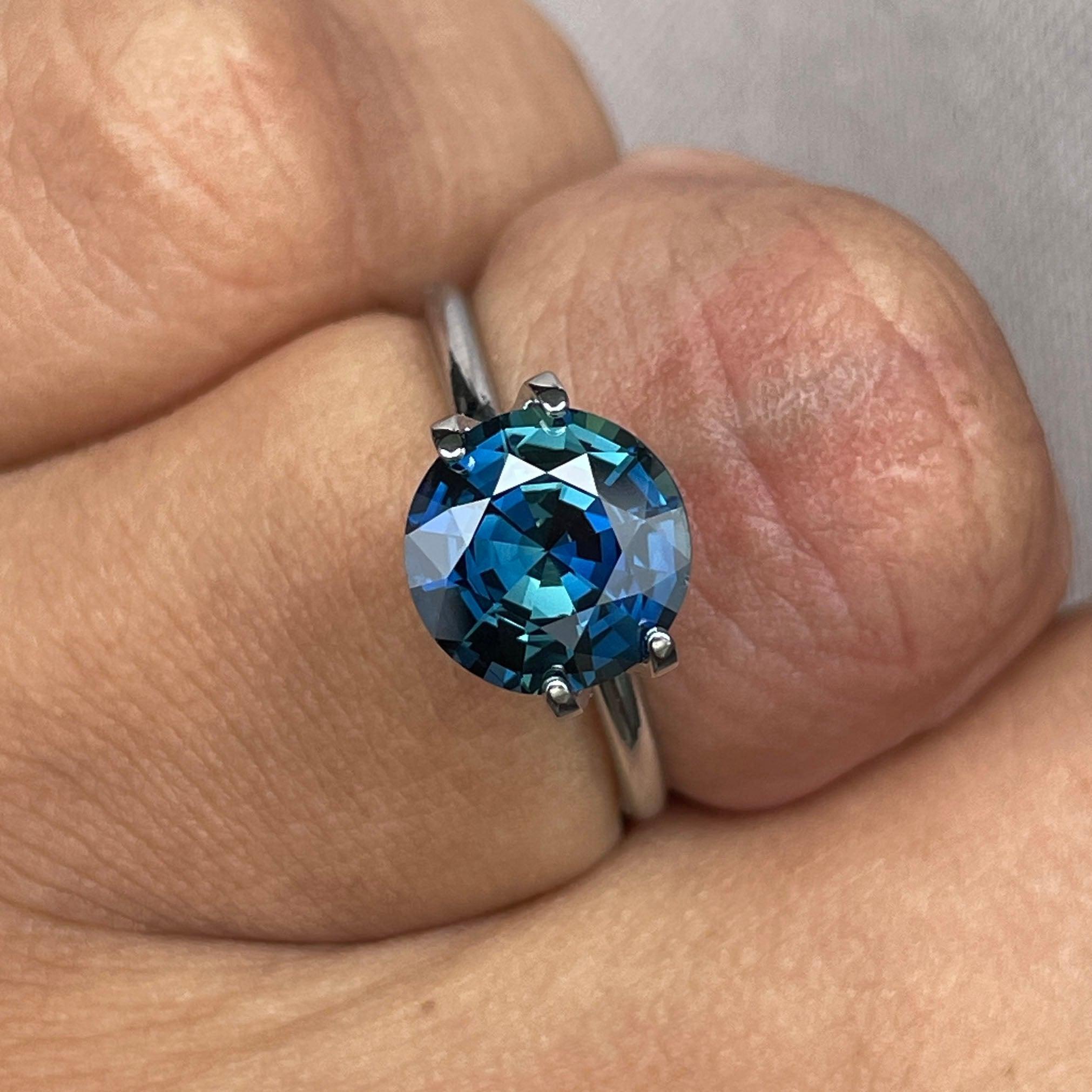 teal blue green parti sapphire round cut gem