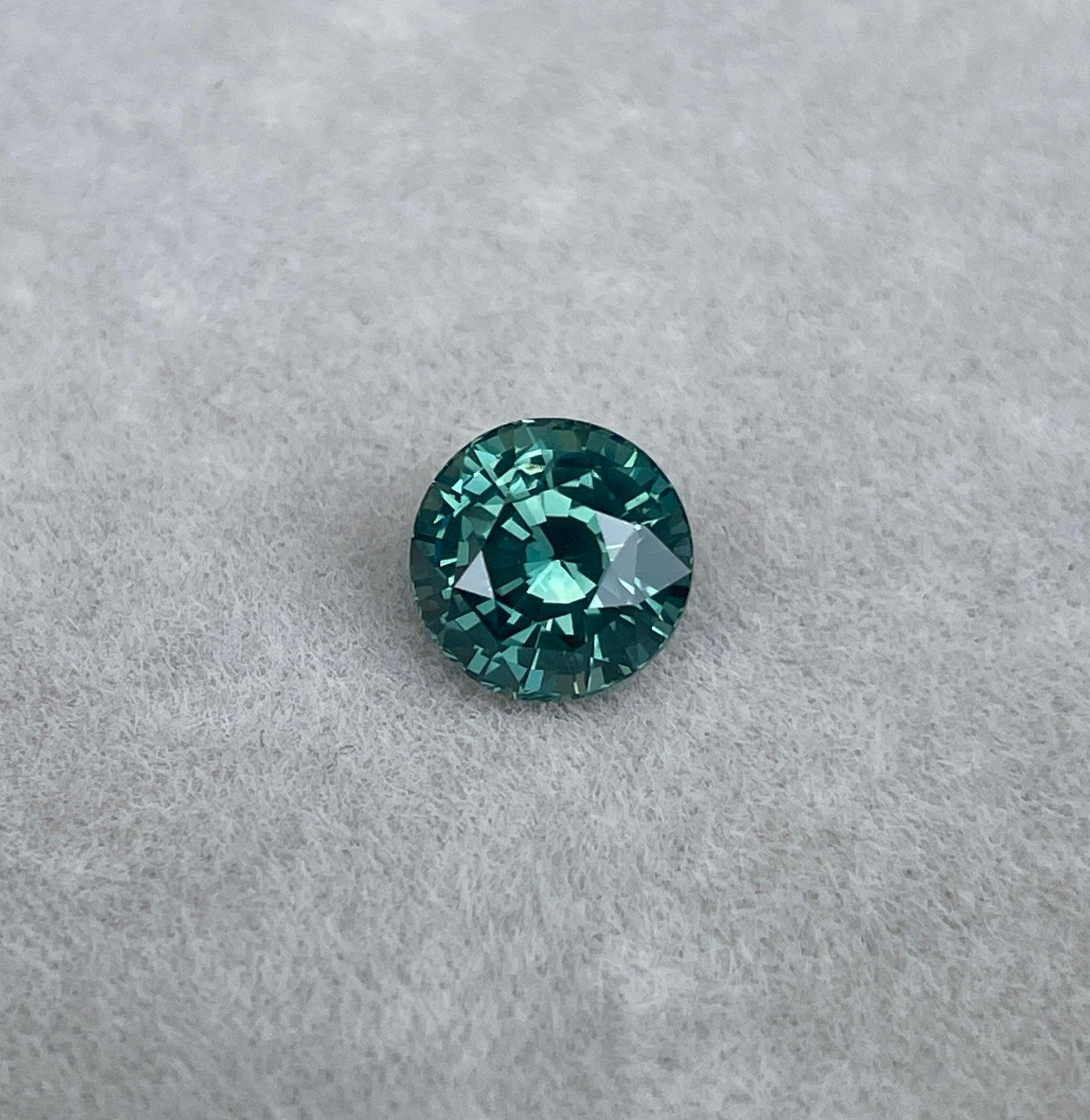 teal blue green parti sapphire round cut gem