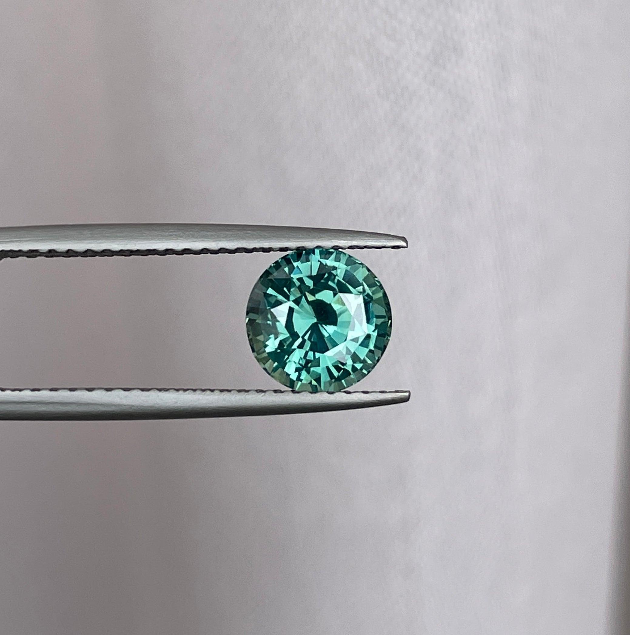 teal blue green parti sapphire round cut gem