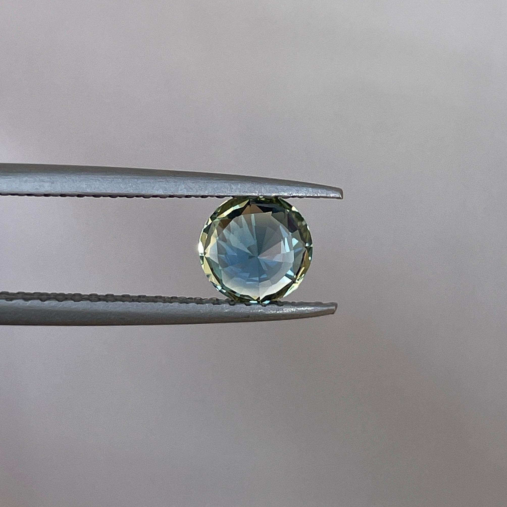 teal blue green parti sapphire round cut gem