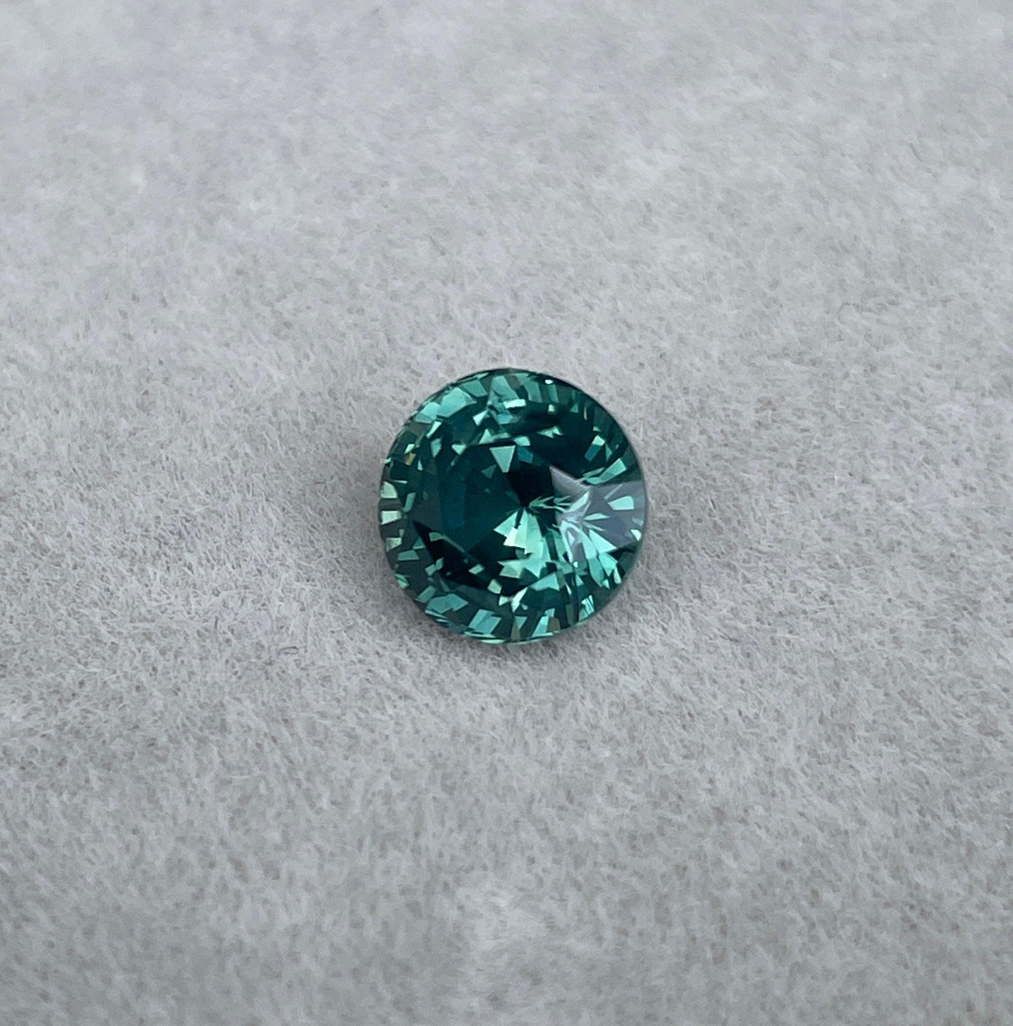 teal blue green parti sapphire round cut gem