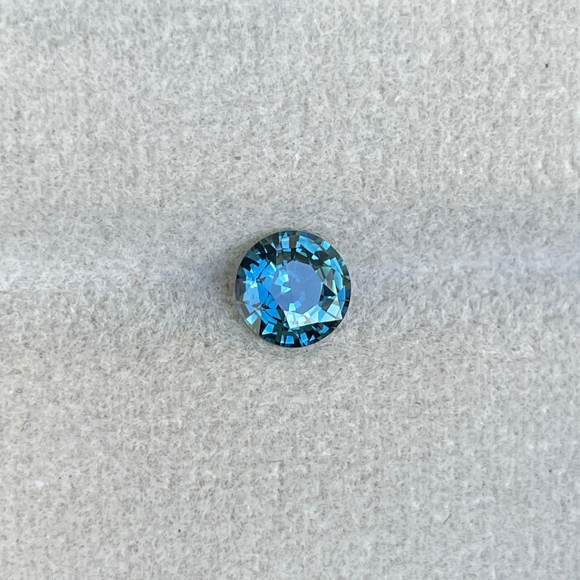 teal blue green parti sapphire round cut gem
