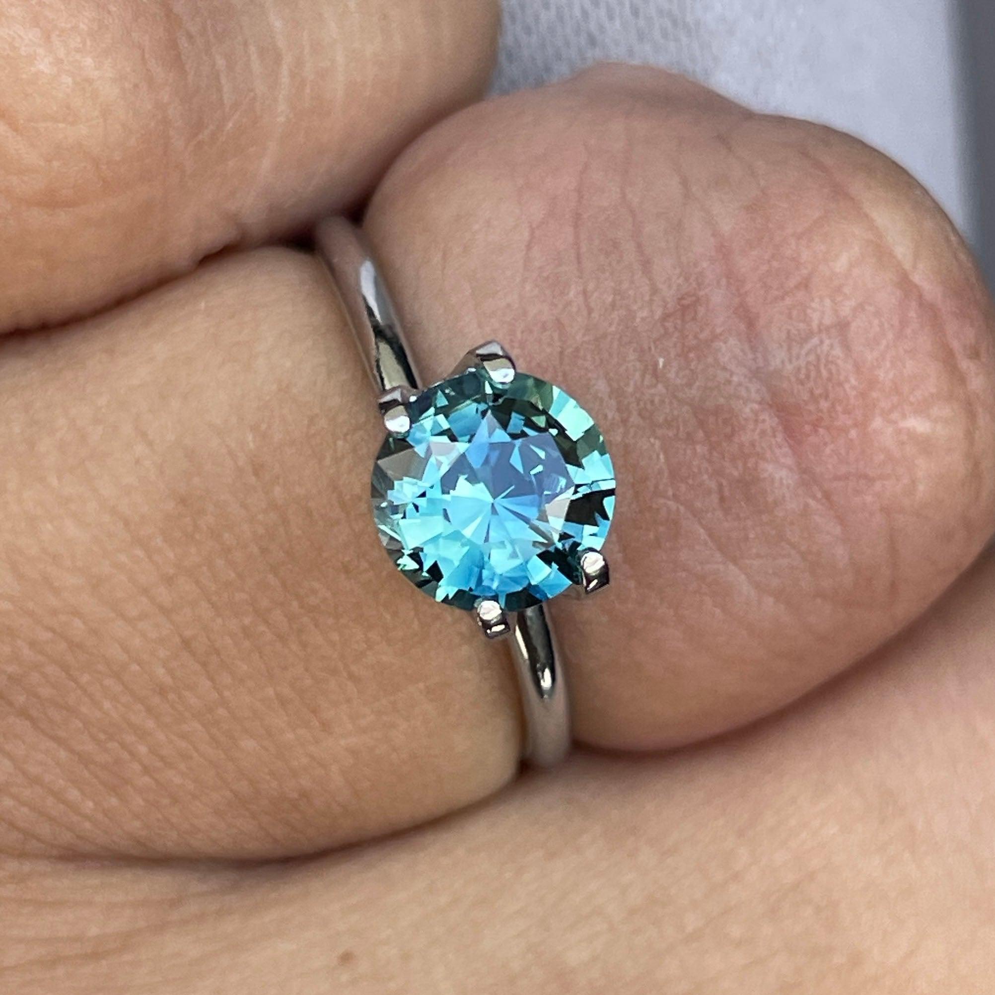 teal blue green parti sapphire round cut gem