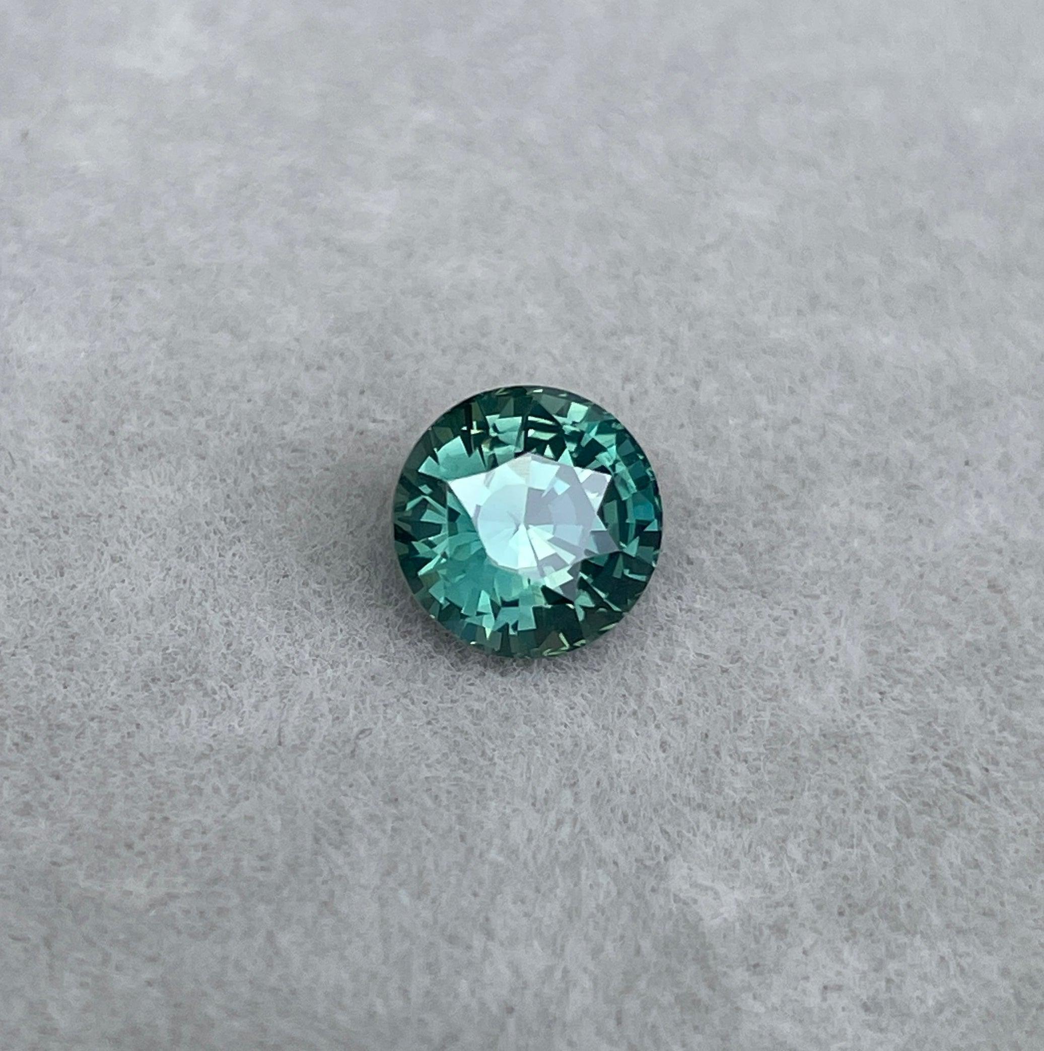 teal blue green parti sapphire round cut gem