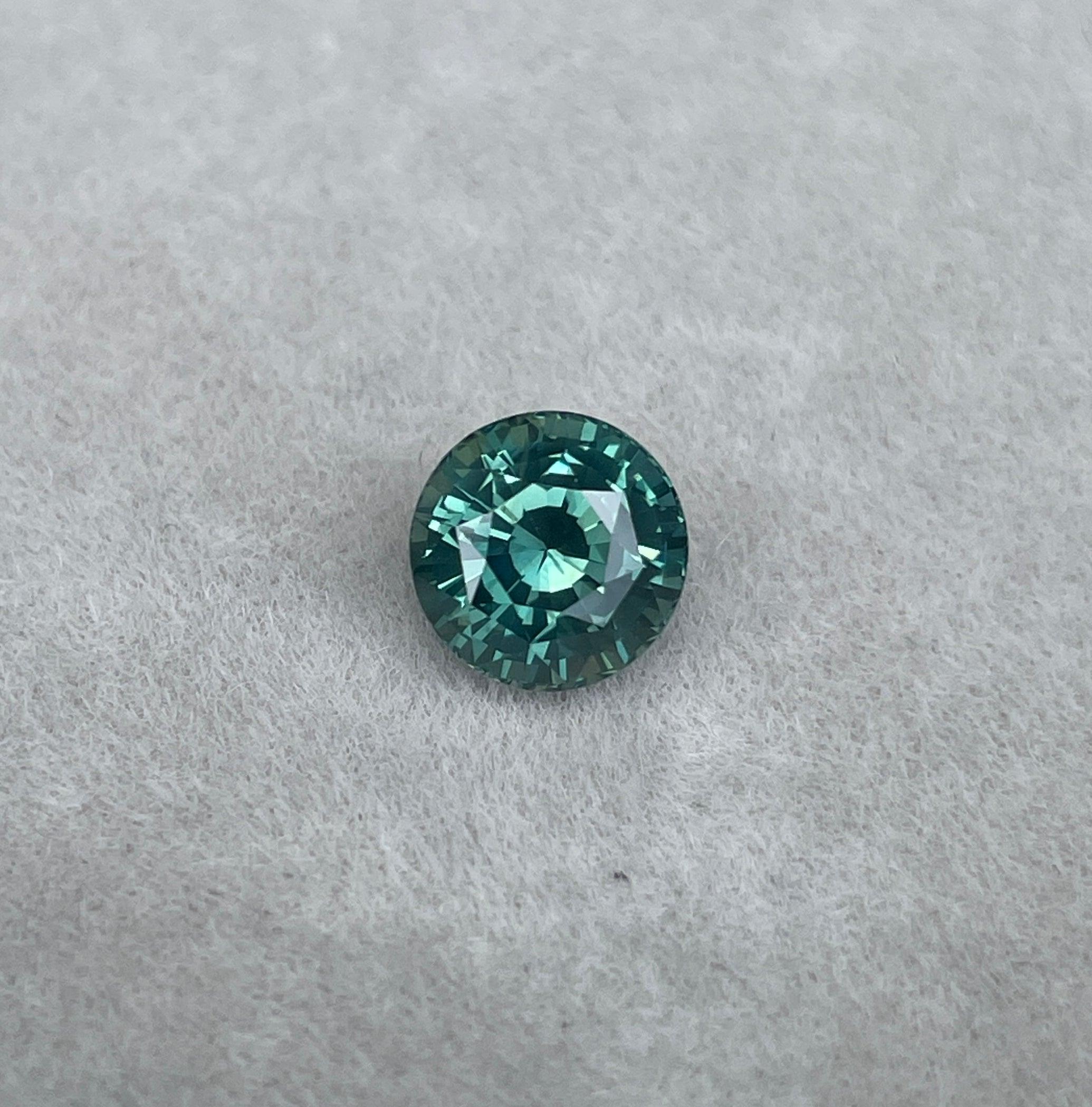 teal blue green parti sapphire round cut gem