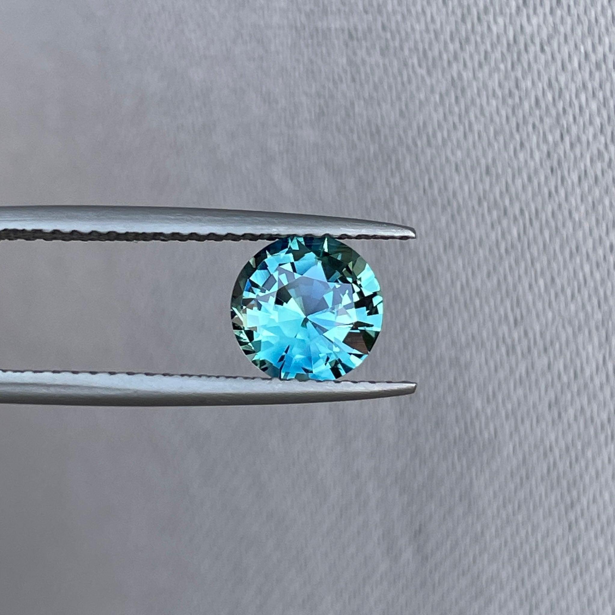 teal blue green parti sapphire round cut gem
