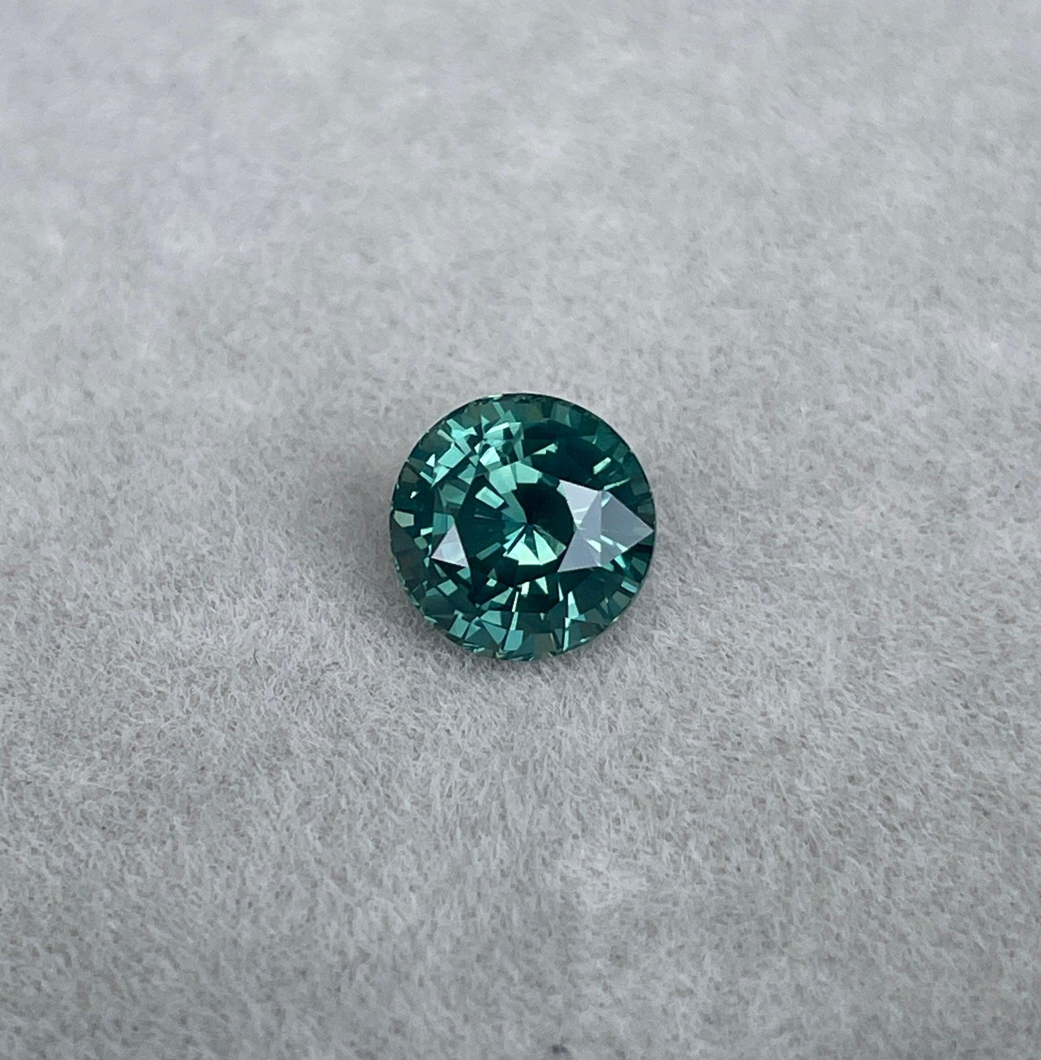 teal blue green parti sapphire round cut gem