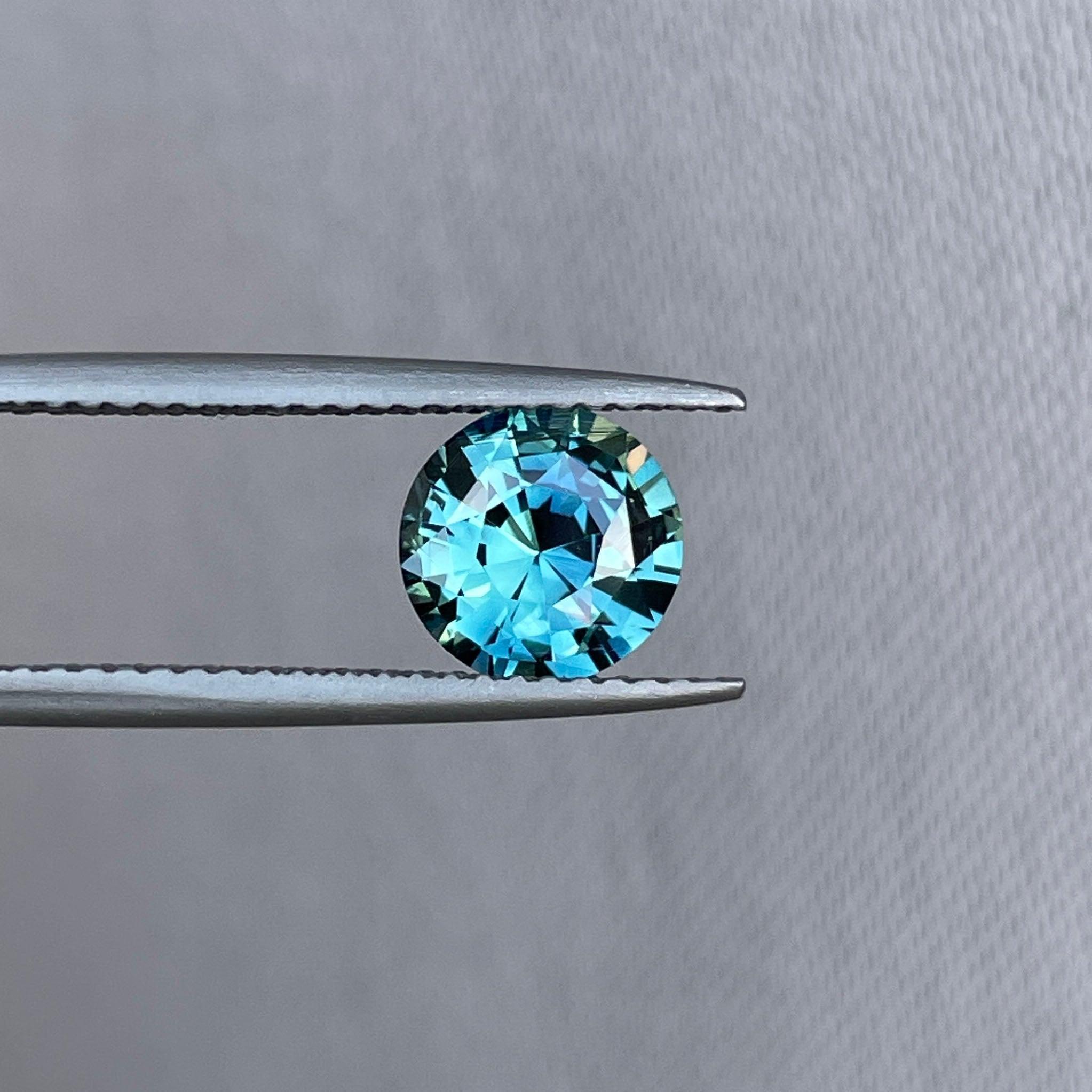 teal blue green parti sapphire round cut gem