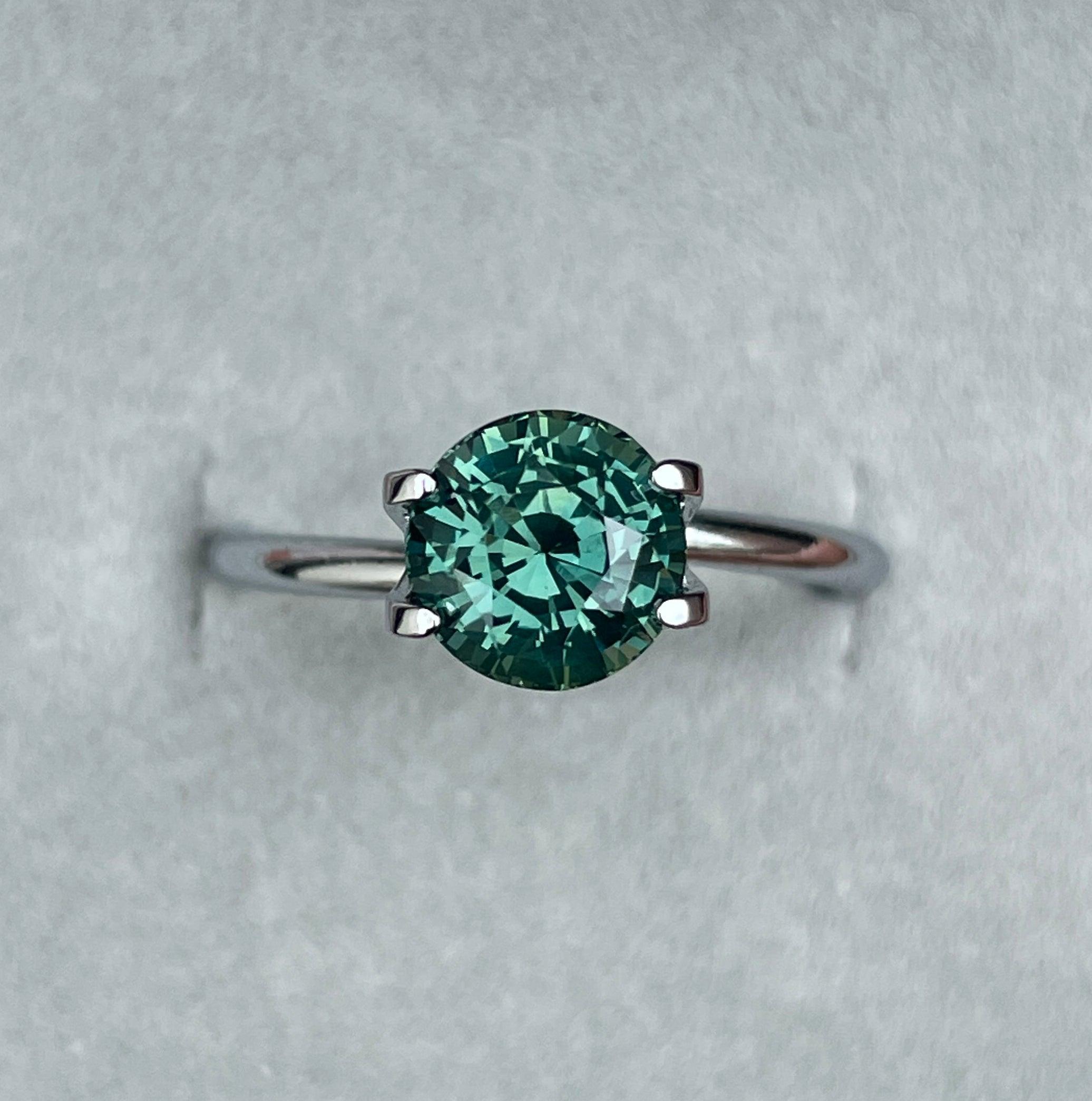 teal blue green parti sapphire round cut gem