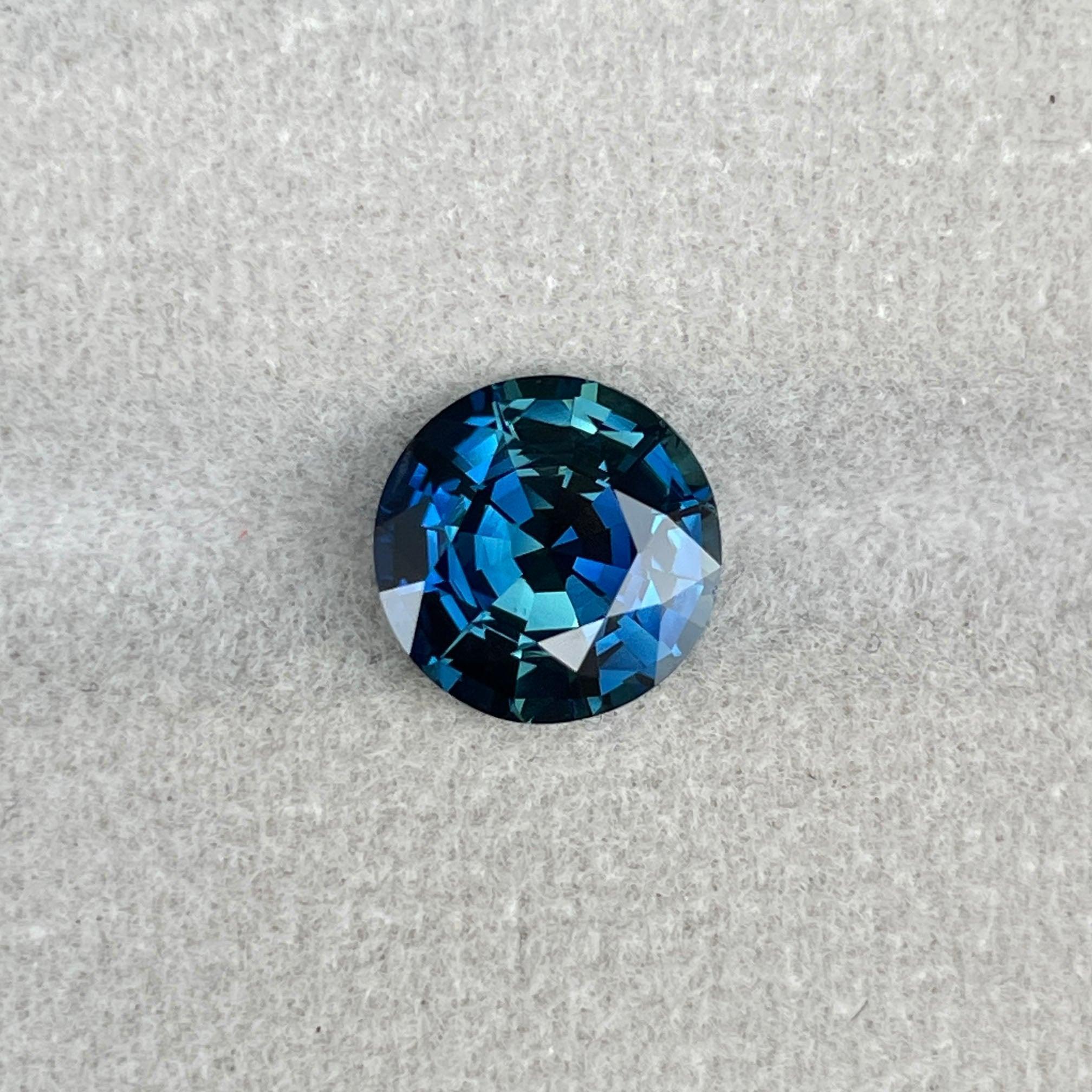teal blue green parti sapphire round cut gem