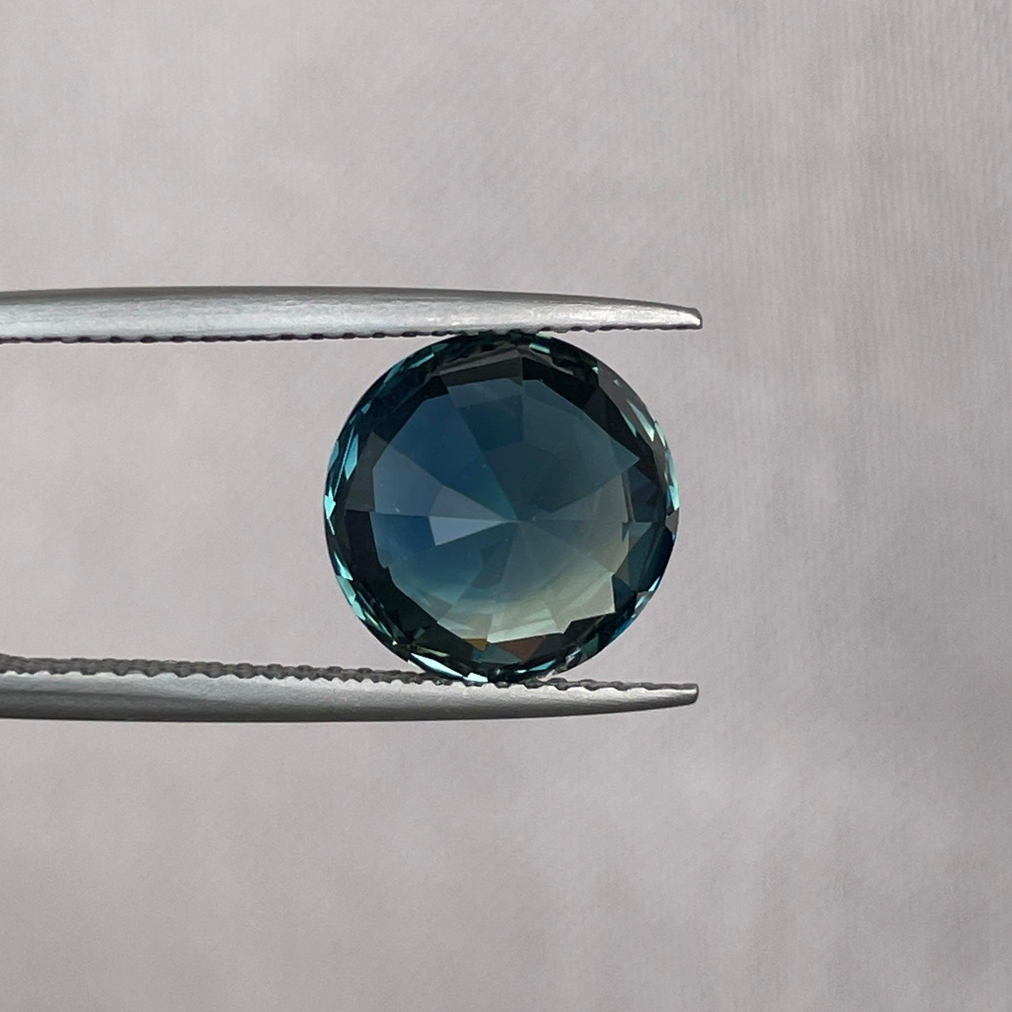 teal blue green parti sapphire round cut gem