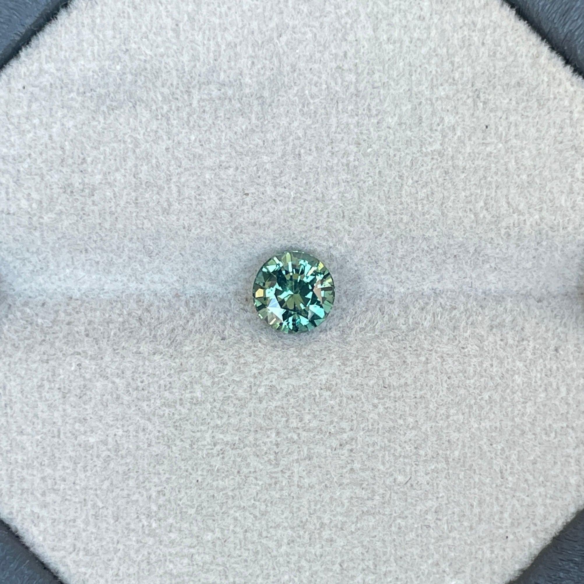 teal blue green parti sapphire round cut gem