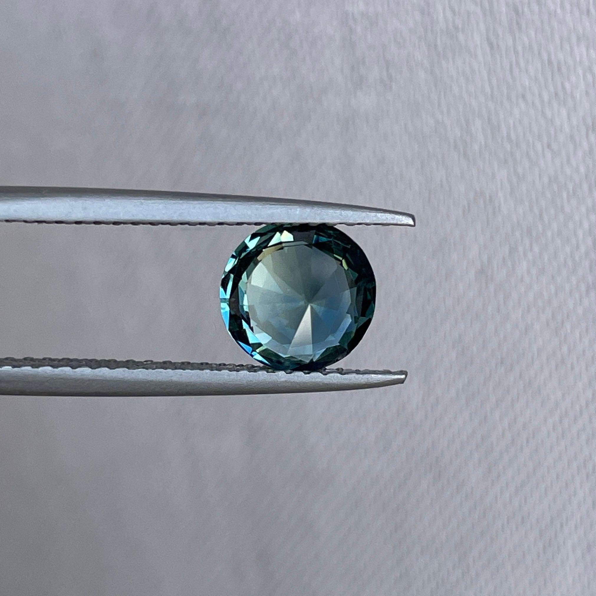 teal blue green parti sapphire round cut gem