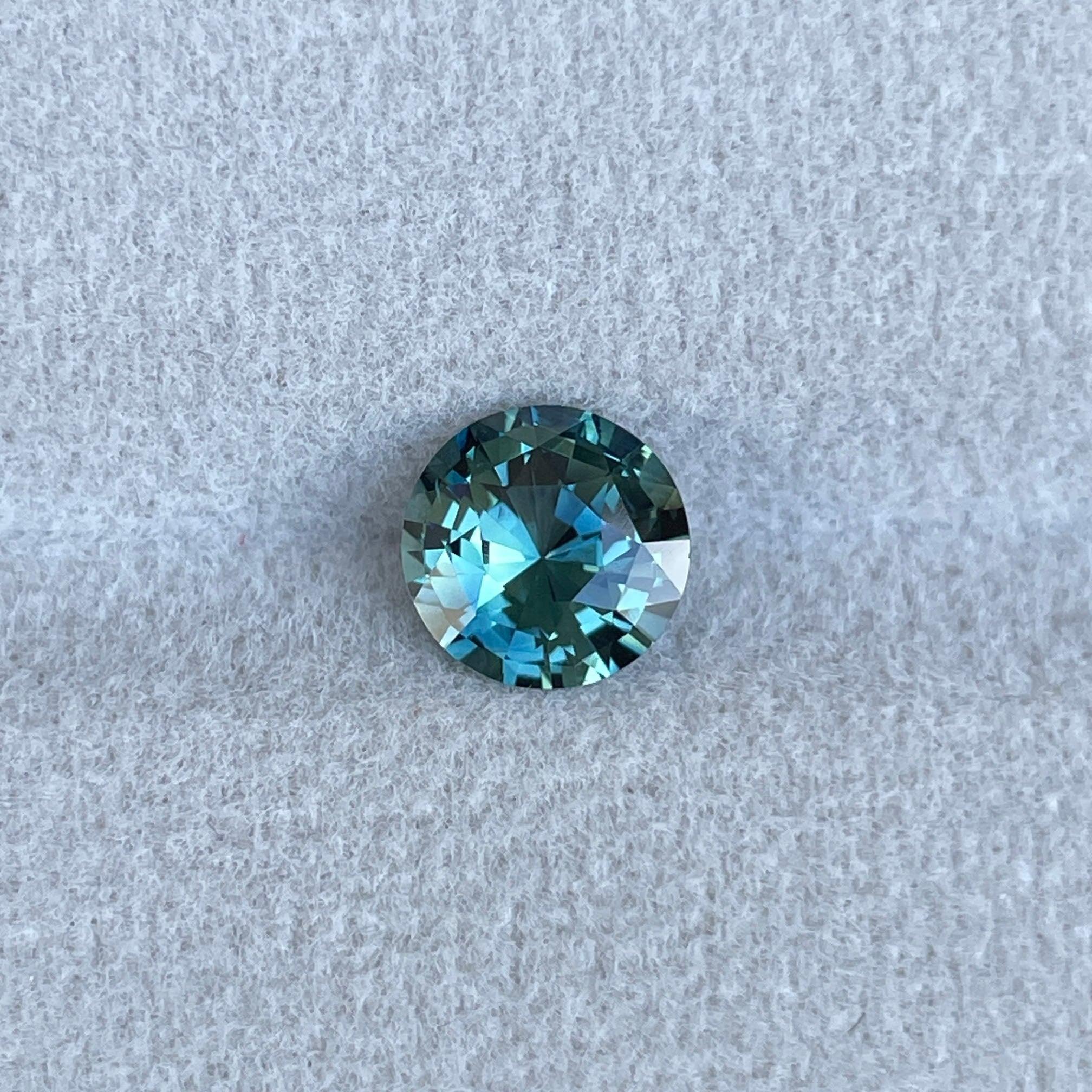 teal blue green parti sapphire round cut gem