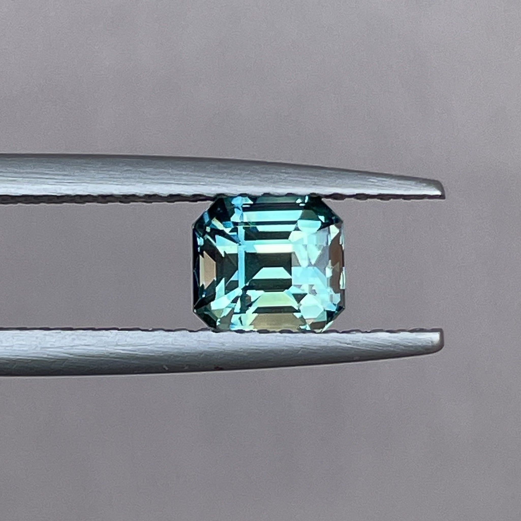 Natural teal green sapphire 1.36 Ct emerald cut by NASHGEMS, loose gemstone ideal for engagement rings or custom jewelry.