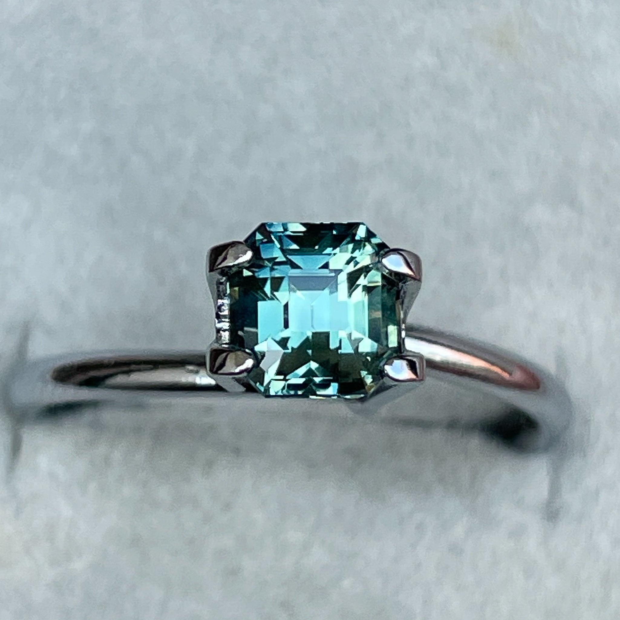 Natural teal green sapphire 1.36 Ct emerald cut loose gemstone by NASHGEMS, ideal for engagement rings or custom jewelry.