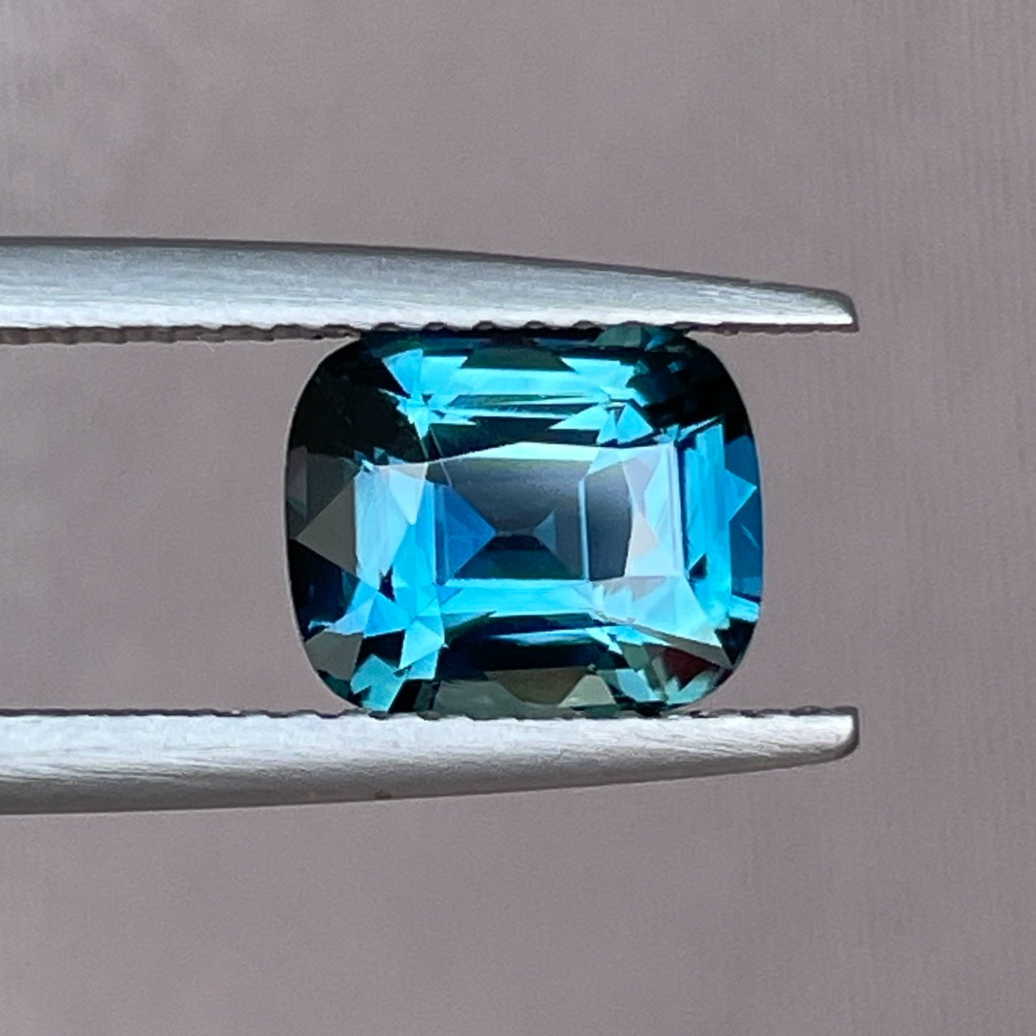 Natural teal blue sapphire 2.52 Ct cushion cut loose gemstone from NASHGEMS, ideal for engagement rings or custom jewelry.