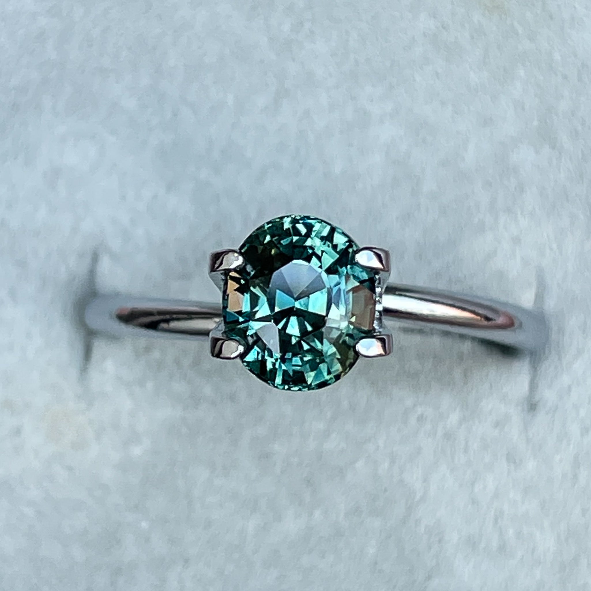 Teal blue green oval cut sapphire gemstone from NASHGEMS, 1.56 Ct loose sapphire for jewelry or engagement rings.
