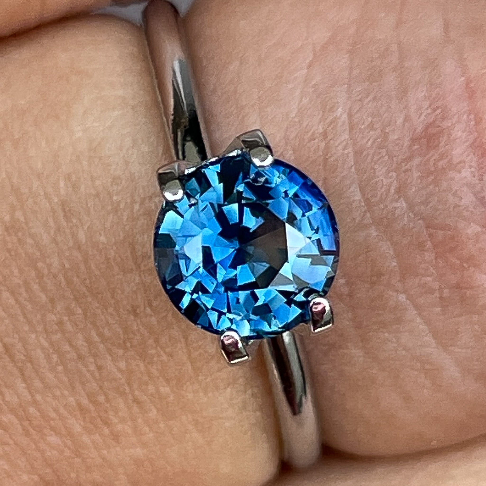 Natural teal blue sapphire 1.65 Ct round cut loose gemstone from NASHGEMS, ideal for engagement rings or custom jewelry.