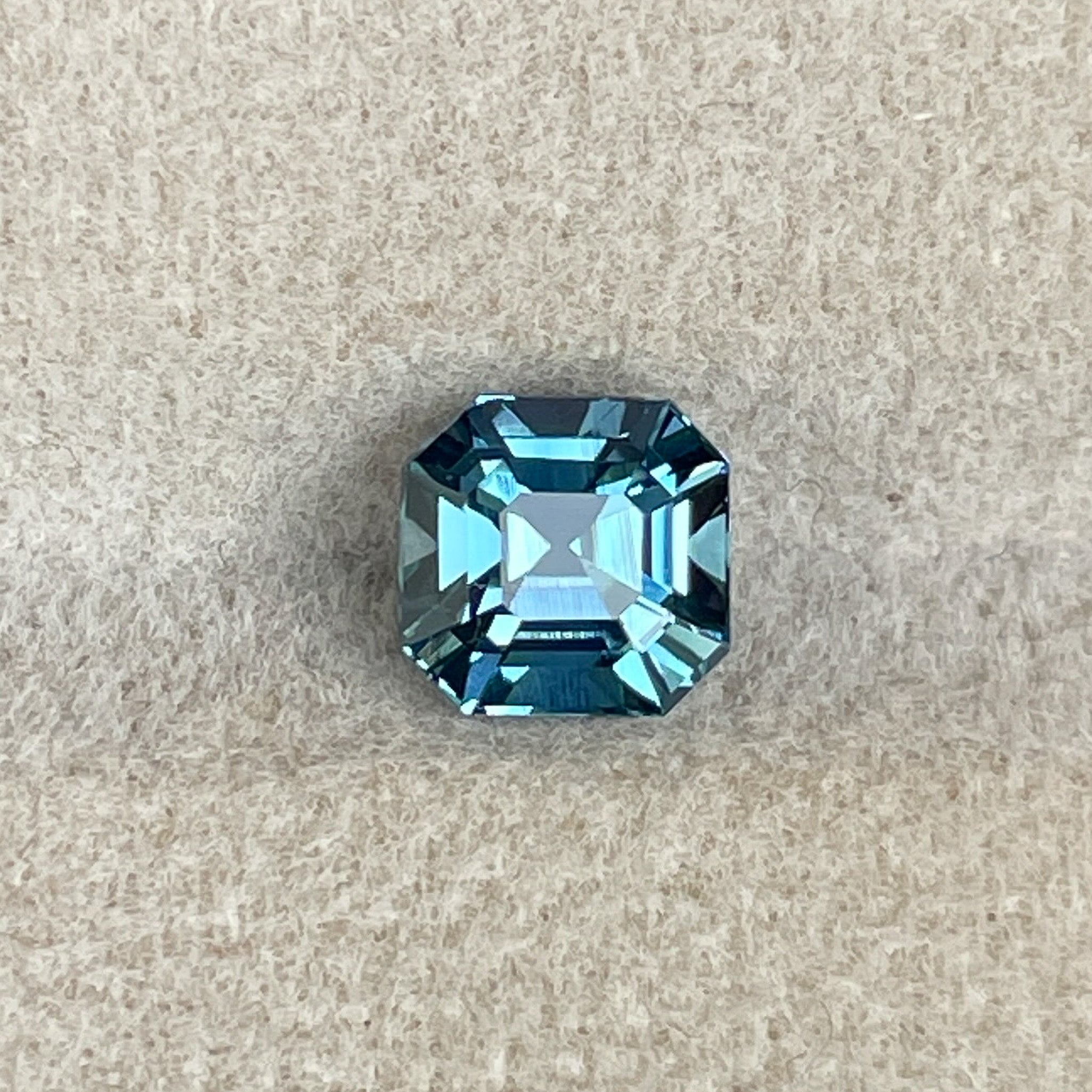 Natural teal sapphire, 1.76 ct Asscher octagon cut, heat-treated loose gemstone by NASHGEMS for engagement or custom jewelry.