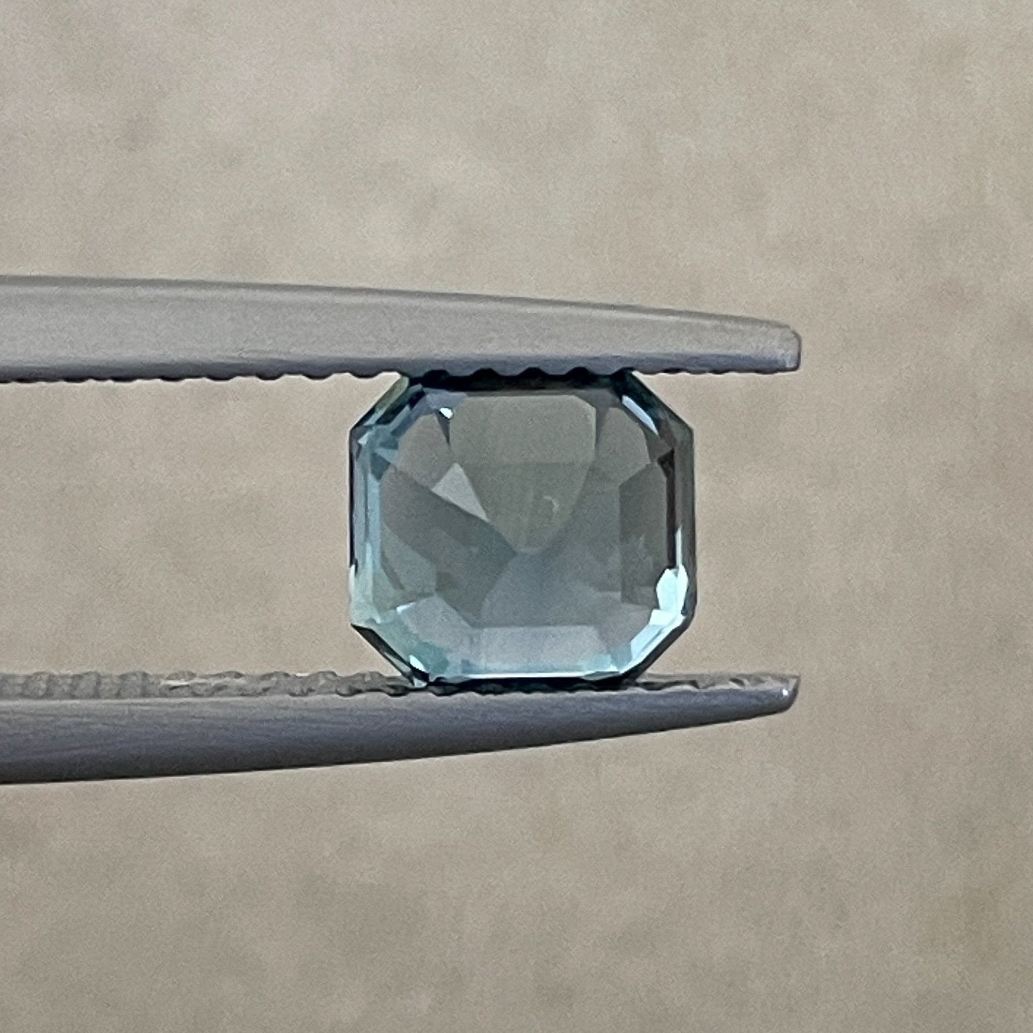 Natural teal sapphire 1.76 Ct Asscher octagon cut by NASHGEMS, heat-treated loose gemstone for engagement or custom jewelry.