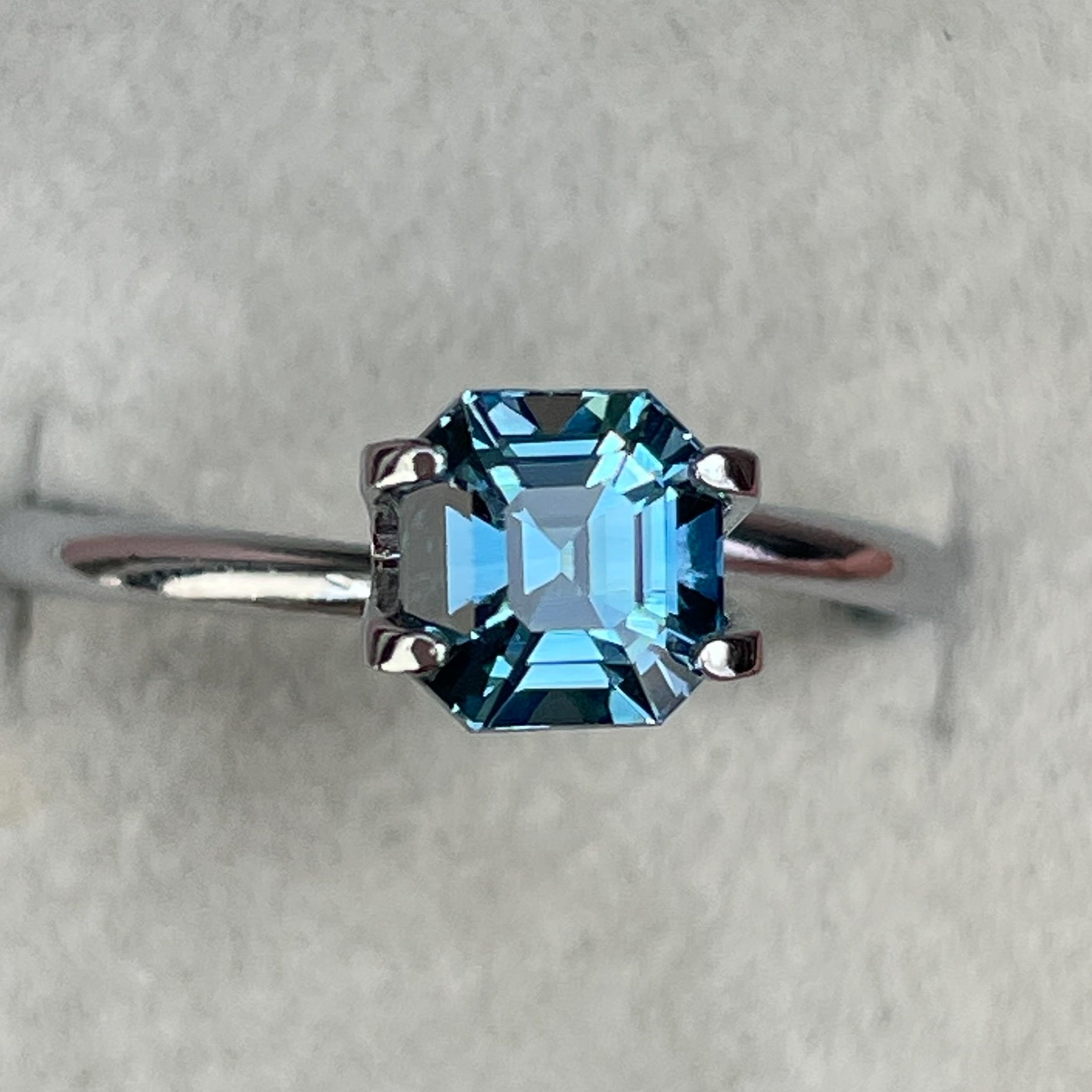 Natural teal sapphire, 1.76 Ct Asscher octagon cut, heat-treated loose gemstone by NASHGEMS for jewelry or engagement rings.
