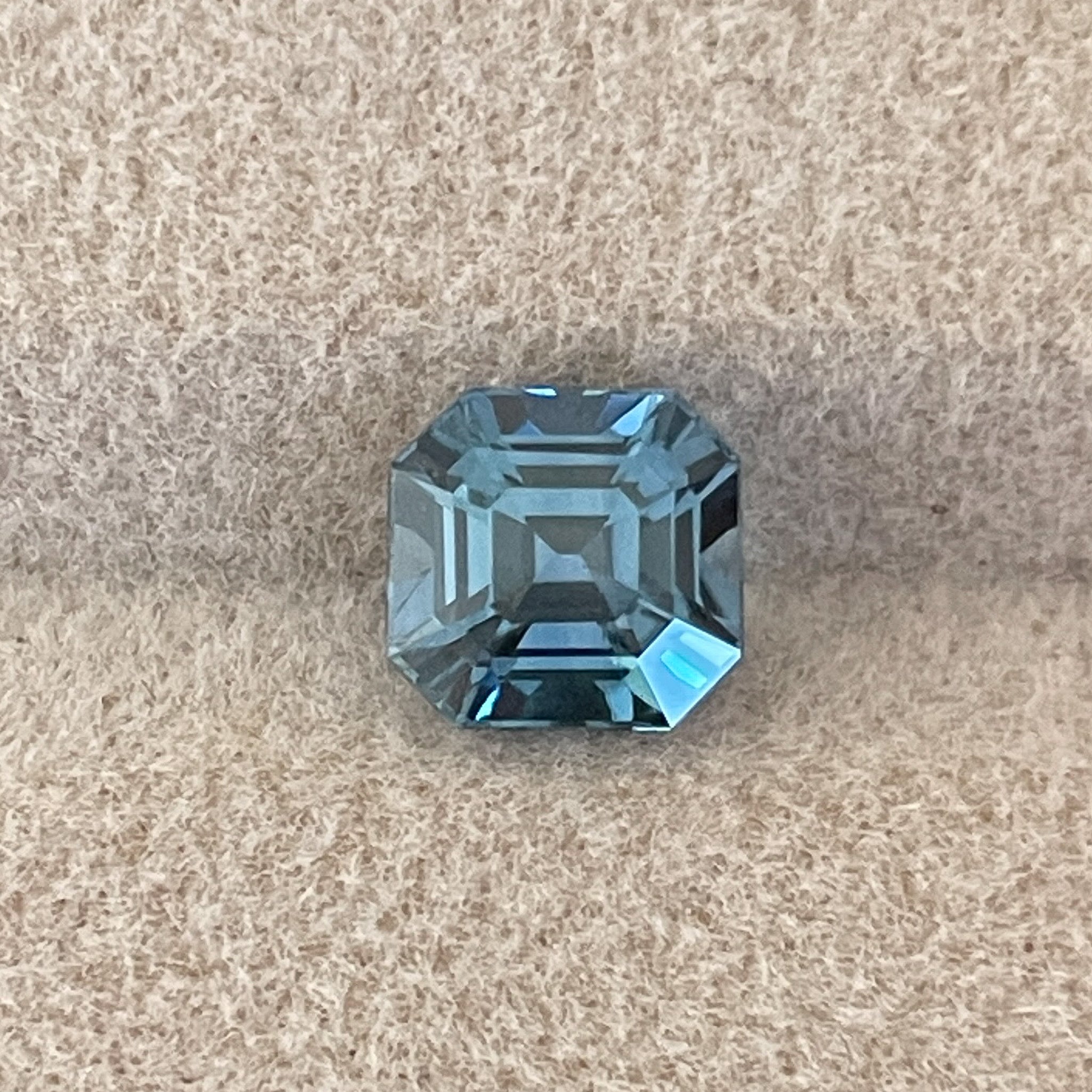 Natural teal sapphire 1.76 Ct Asscher octagon cut by NASHGEMS, heat-treated loose gemstone for engagement or custom jewelry.