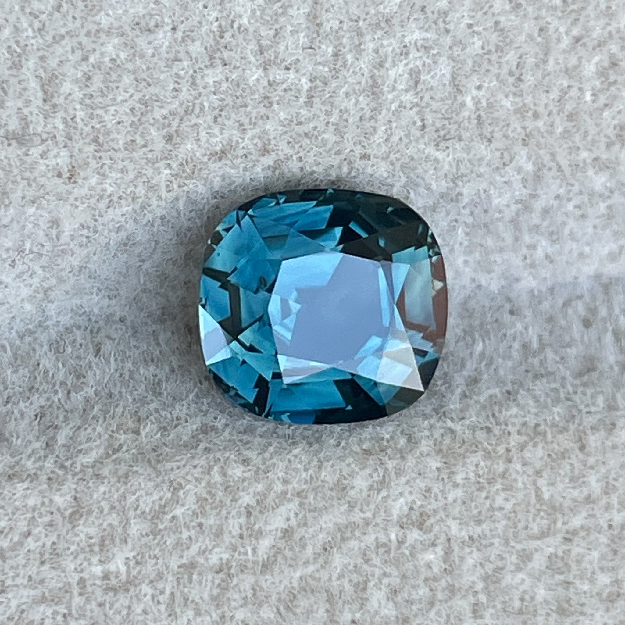Natural teal sapphire 2.02 Ct cushion cut loose gemstone by NASHGEMS, ideal for engagement rings or custom jewelry.