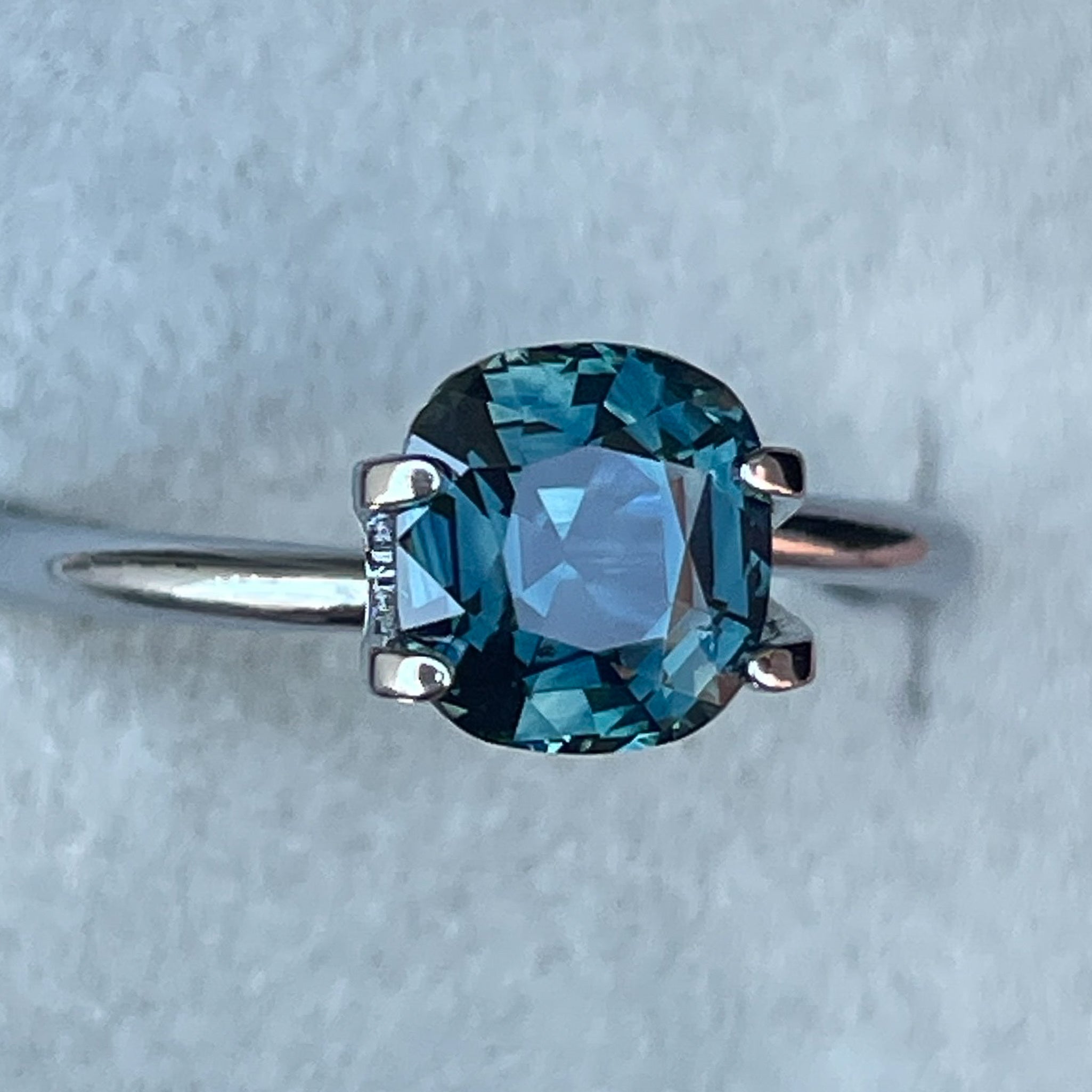 Natural teal sapphire cushion cut 2.02 Ct from NASHGEMS, loose gemstone ideal for engagement rings or custom jewelry design.