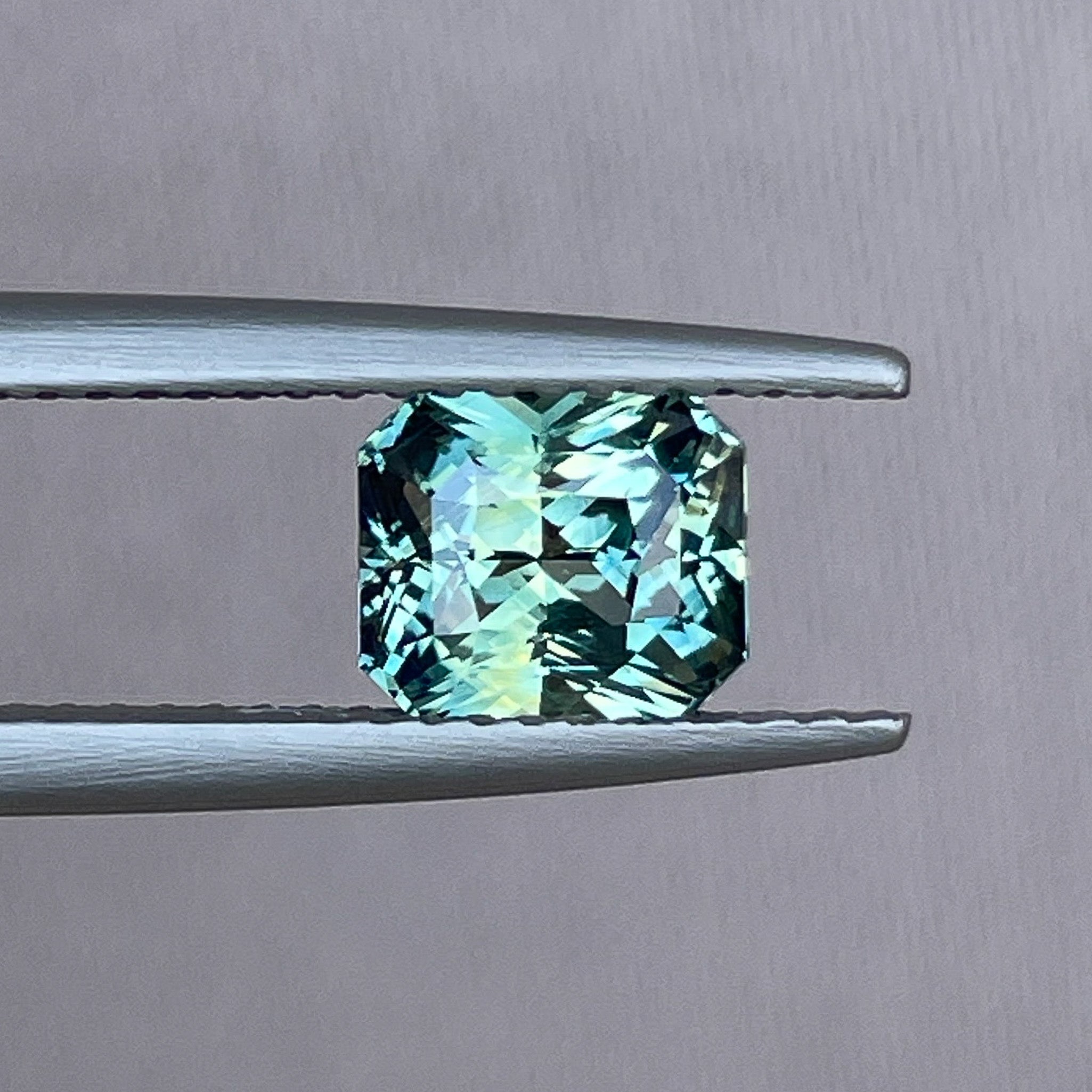 Natural teal sapphire loose gemstone, radiant cut, 1.65 Ct, no heat, from NASHGEMS, ideal for engagement rings.