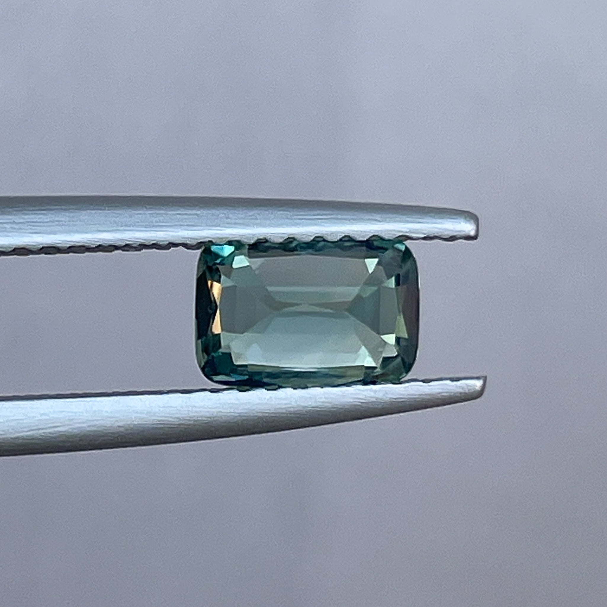 Natural pale green sapphire, 1.14 ct cushion cut teal loose gemstone by NASHGEMS for engagement or custom jewelry.