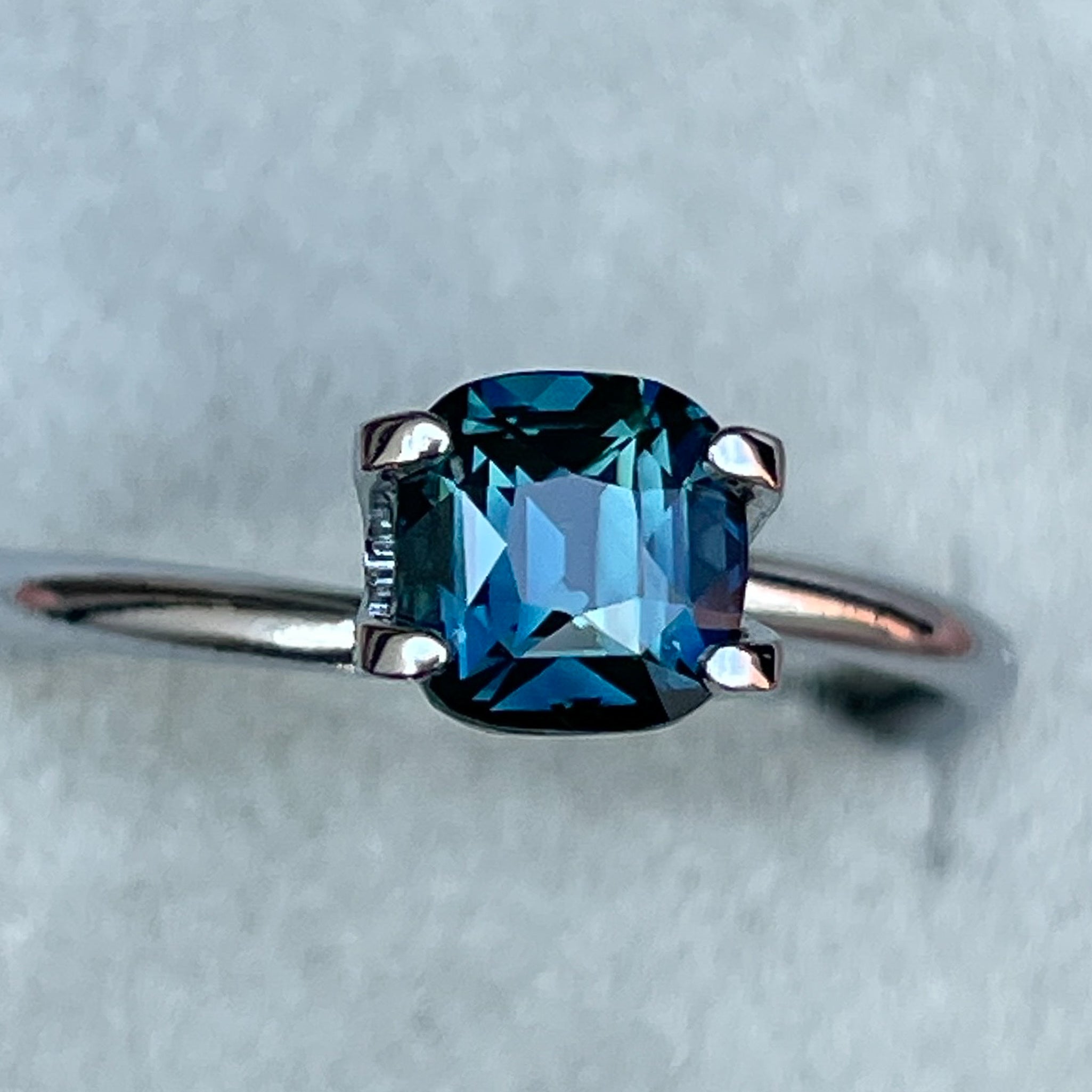 Natural teal blue sapphire loose gemstone, 1.52 Ct cushion cut by NASHGEMS, suitable for engagement rings or custom jewelry.