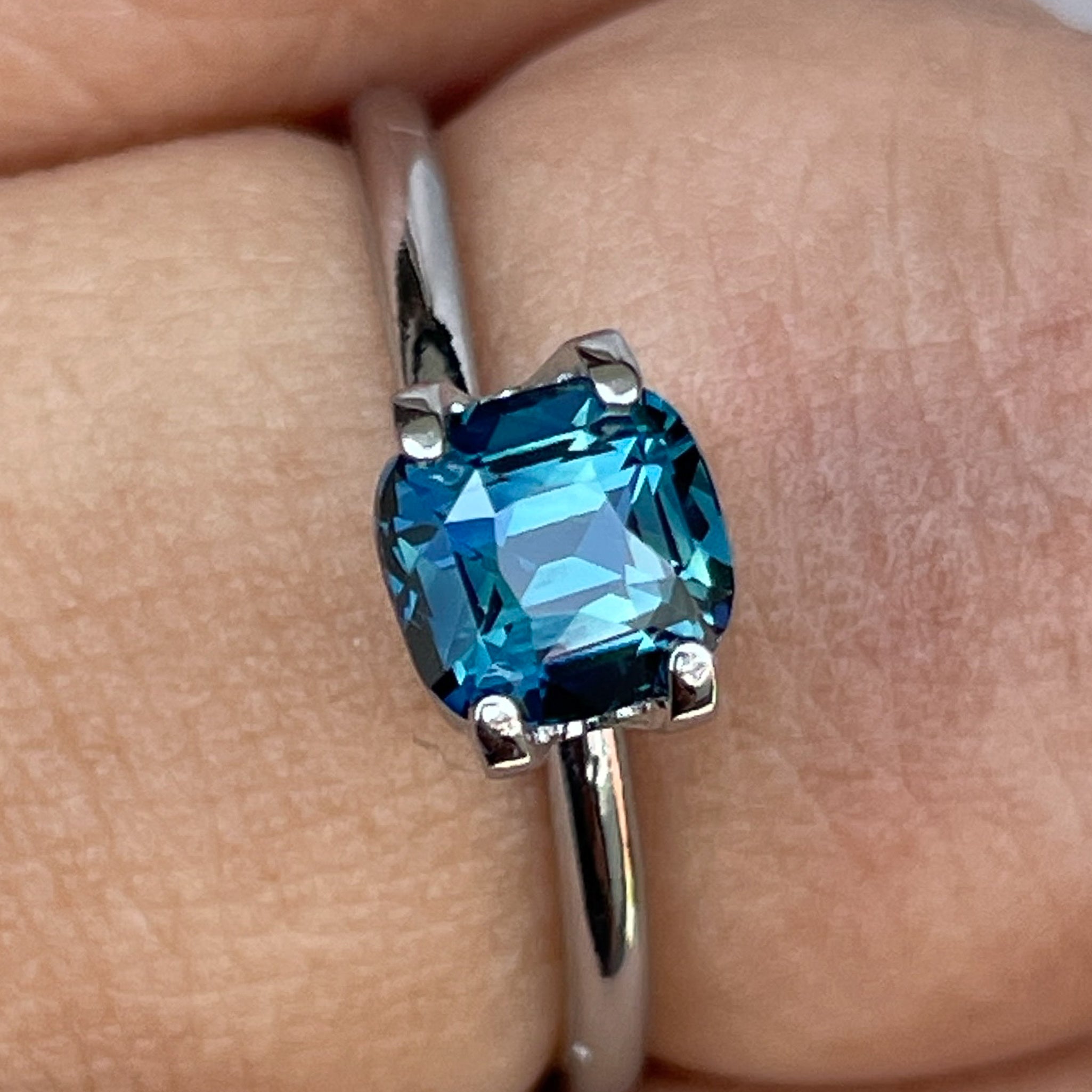 Natural teal blue sapphire 1.52 Ct cushion cut loose gemstone from NASHGEMS, ideal for engagement rings or custom jewelry.