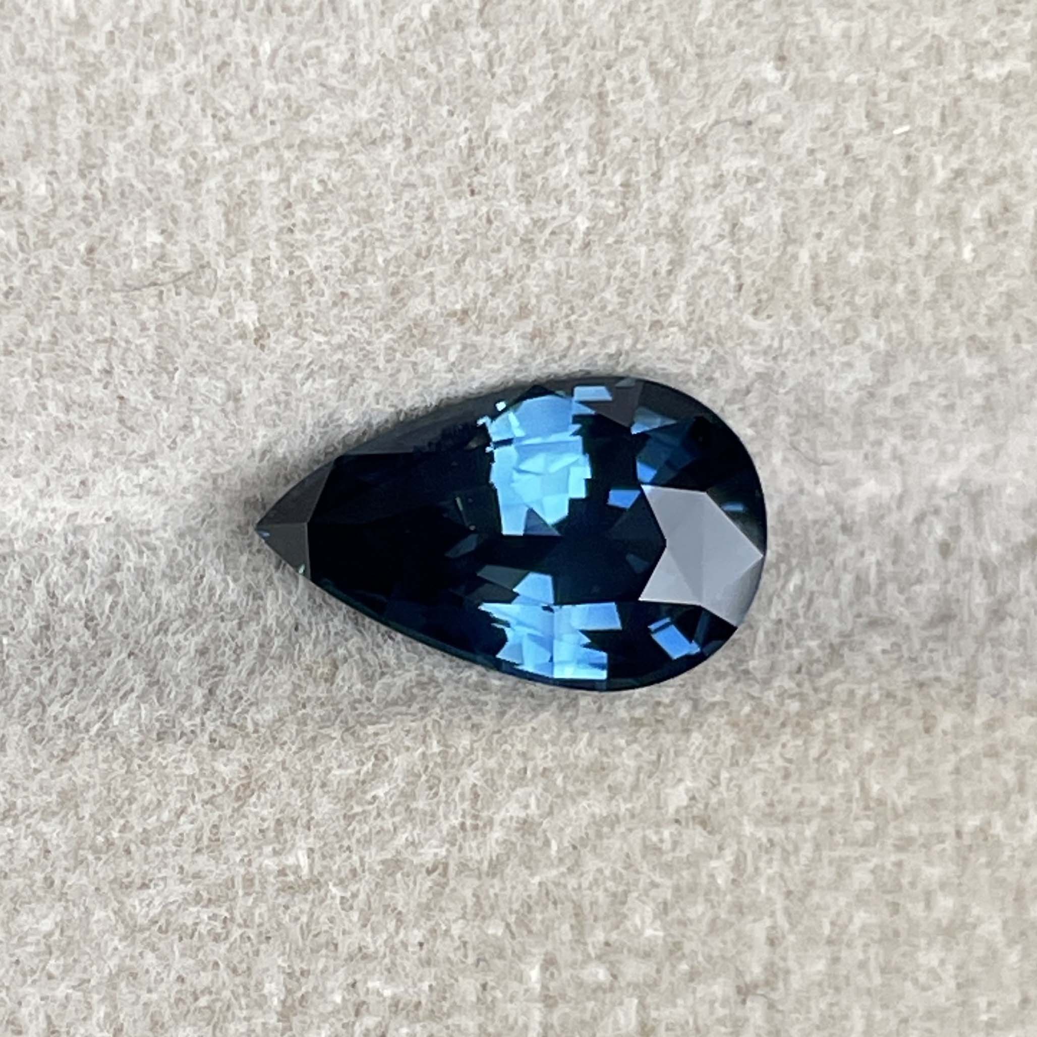 Teal blue and green pear-shaped sapphire gemstone, 2.15 carats, loose cut, ideal for engagement or wedding jewelry from NASHGEMS.