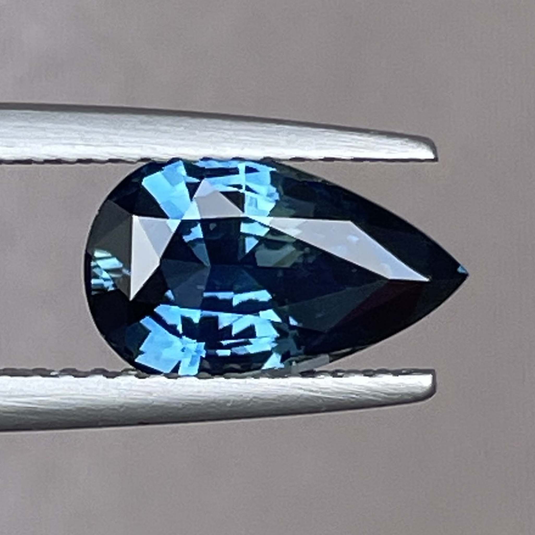 Teal blue-green sapphire pear-shaped loose gemstone, 2.15 carats, custom cut for engagement or wedding rings, by NASHGEMS.
