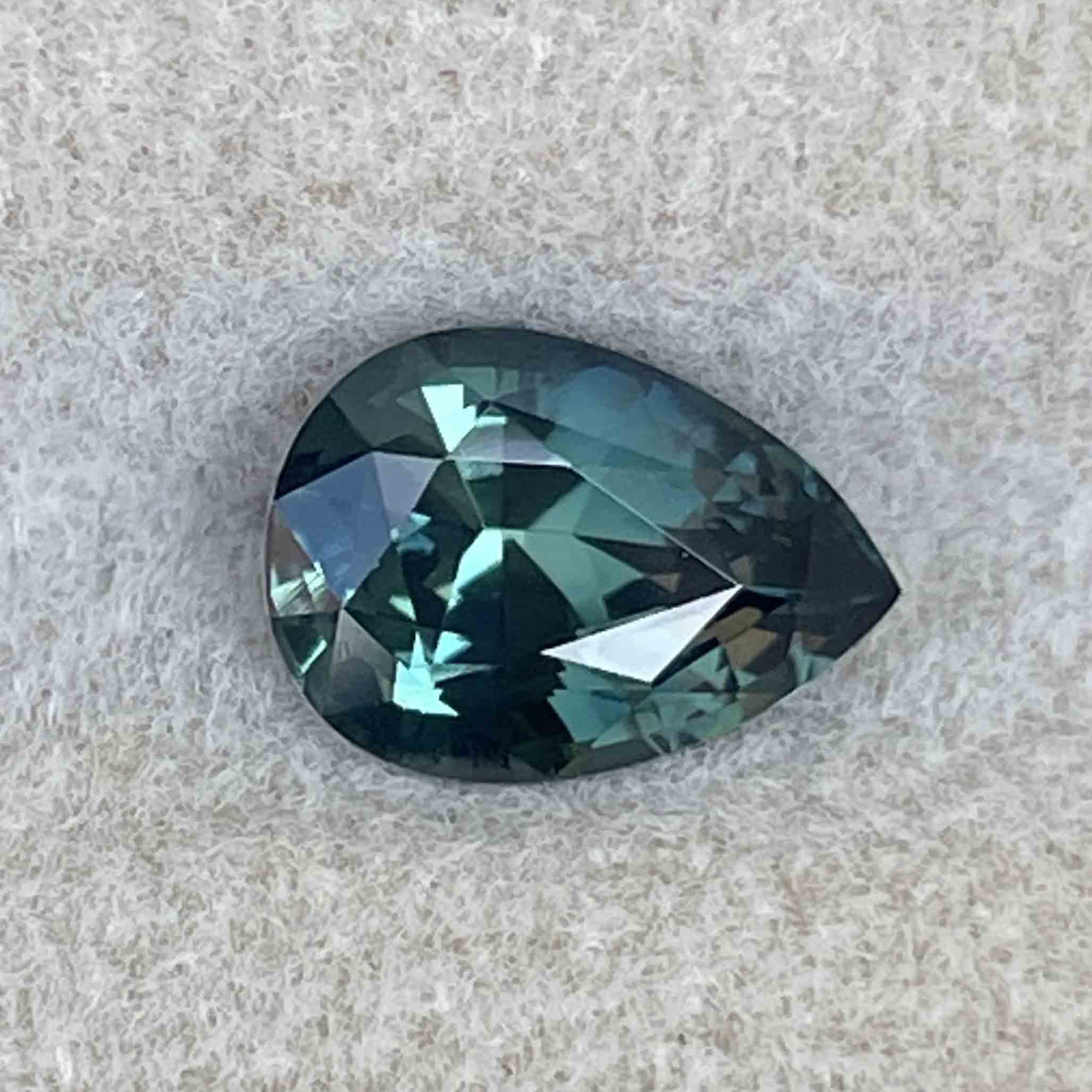 Natural teal blue green sapphire, 1.57 ct pear-shaped loose gemstone by NASHGEMS, perfect for custom engagement rings.