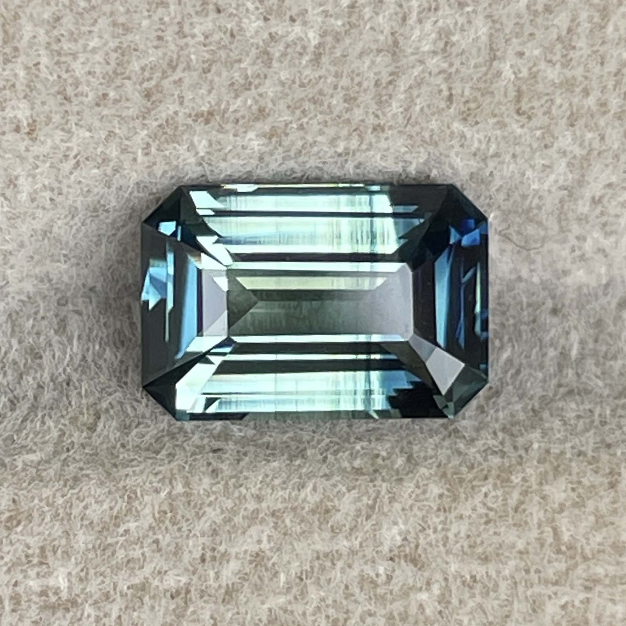 Teal natural bi-color sapphire with 2.07 Ct emerald cut, no heat blue-green sapphire for engagement ring by NASHGEMS.