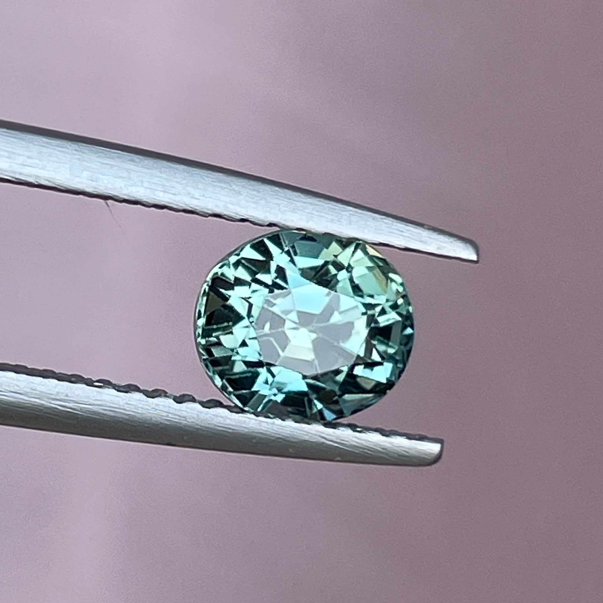 Natural teal sapphire 1.65 Ct oval cut loose gemstone from NASHGEMS, suitable for engagement rings or custom jewelry.