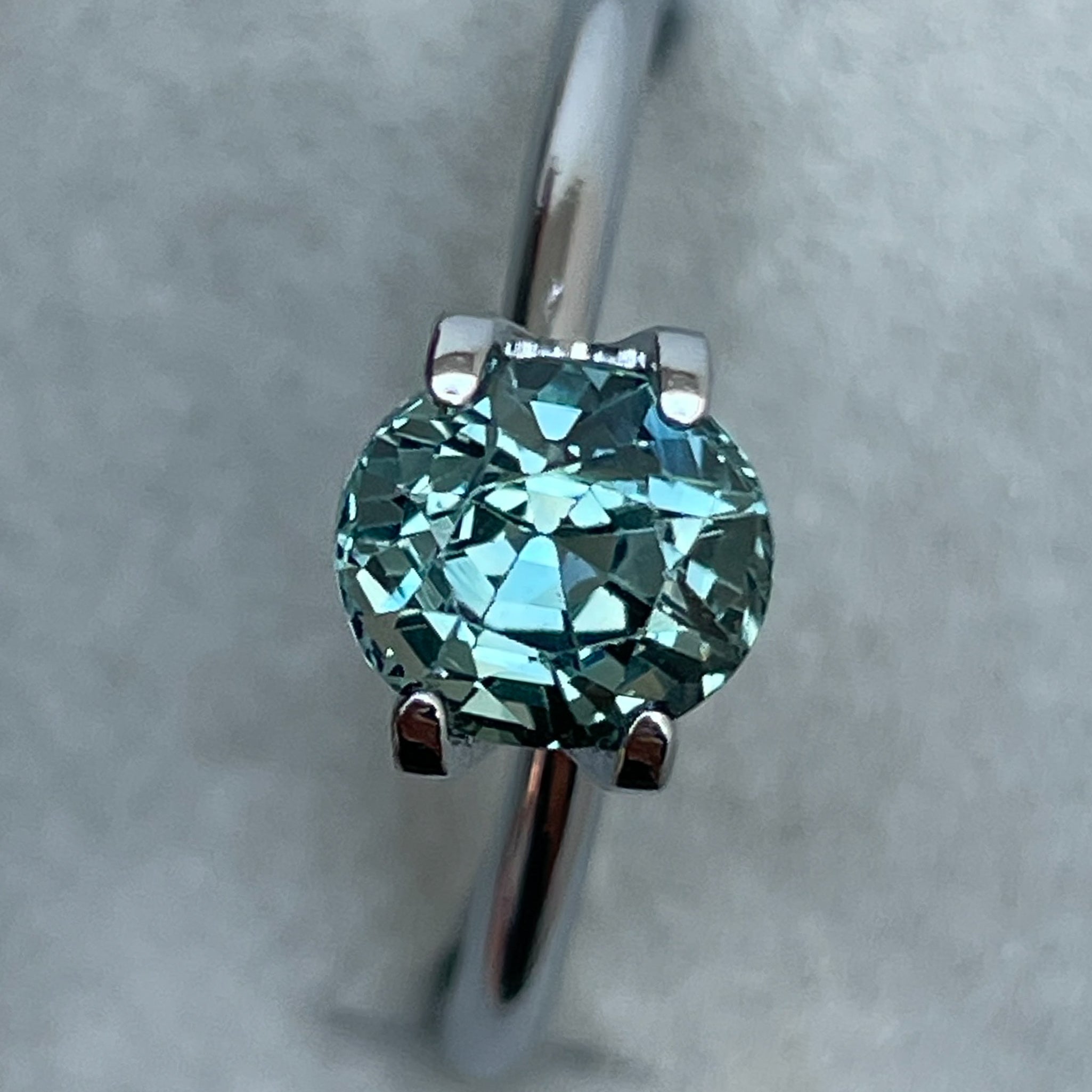 Natural teal sapphire loose stone, 1.65 Ct oval cut by NASHGEMS, ideal for engagement rings or custom jewelry.