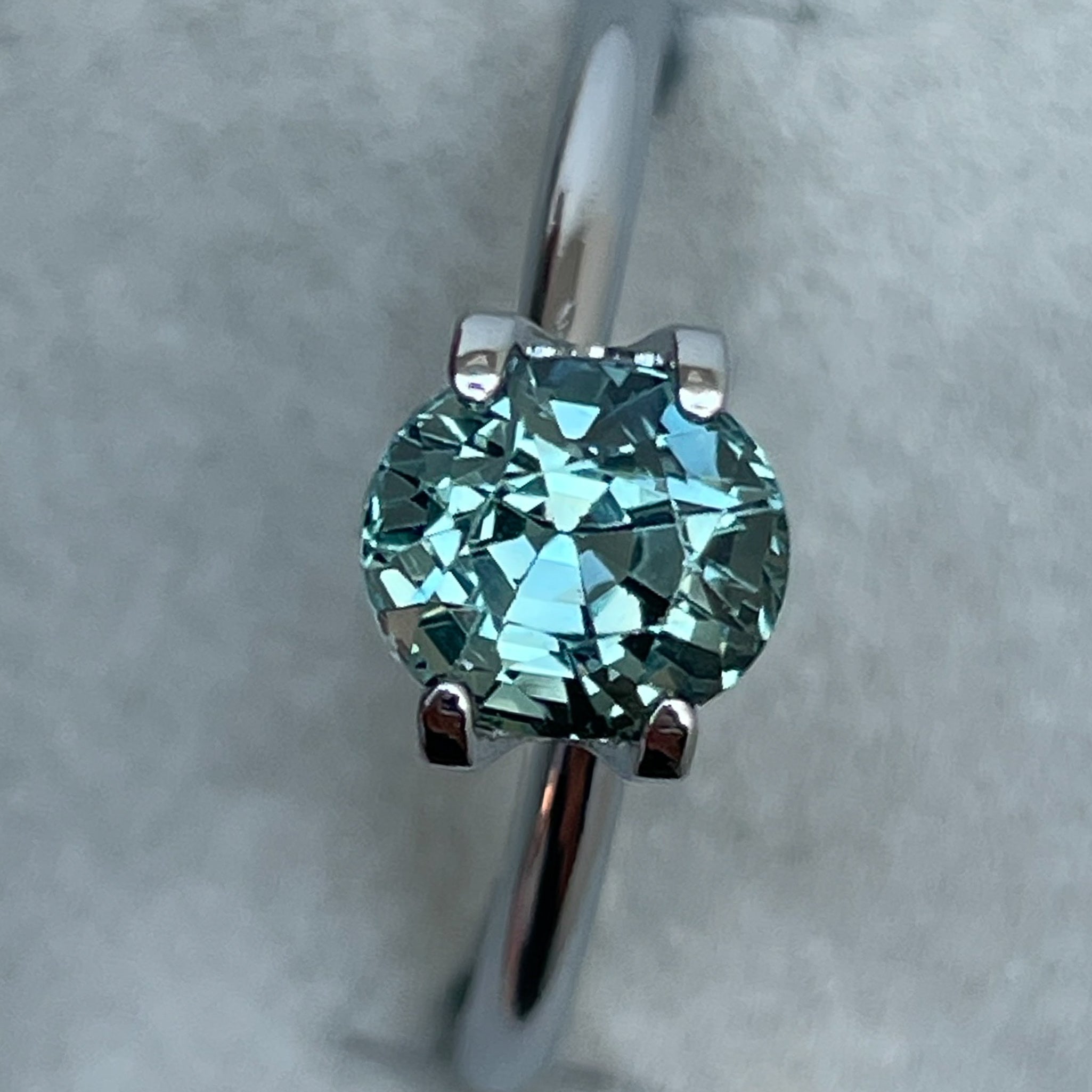 Natural teal sapphire loose stone, 1.65 Ct oval cut by NASHGEMS, ideal for engagement rings or custom jewelry.