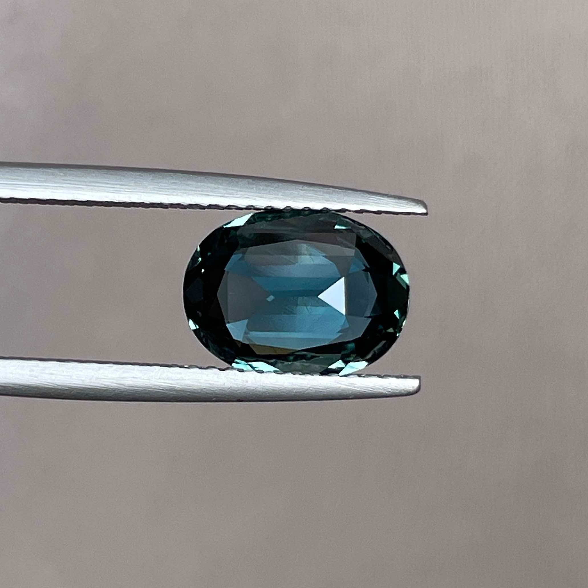 Teal blue-green oval sapphire loose gemstone, 3.19 carats, no heat, suitable for engagement rings or custom jewelry, by NASHGEMS.