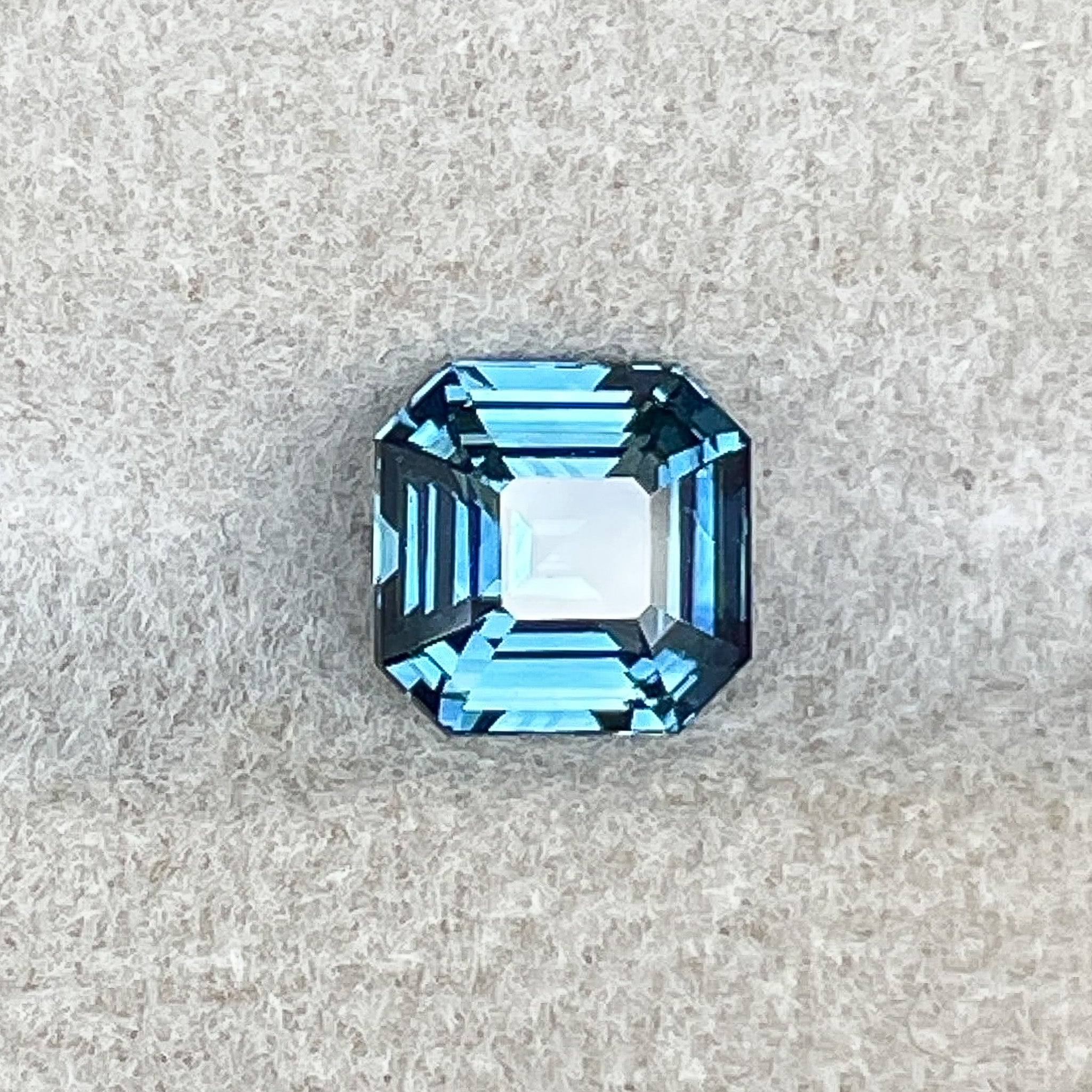 Natural teal blue sapphire 1.52 Ct emerald cut loose gemstone by NASHGEMS, perfect for engagement rings or custom jewelry.