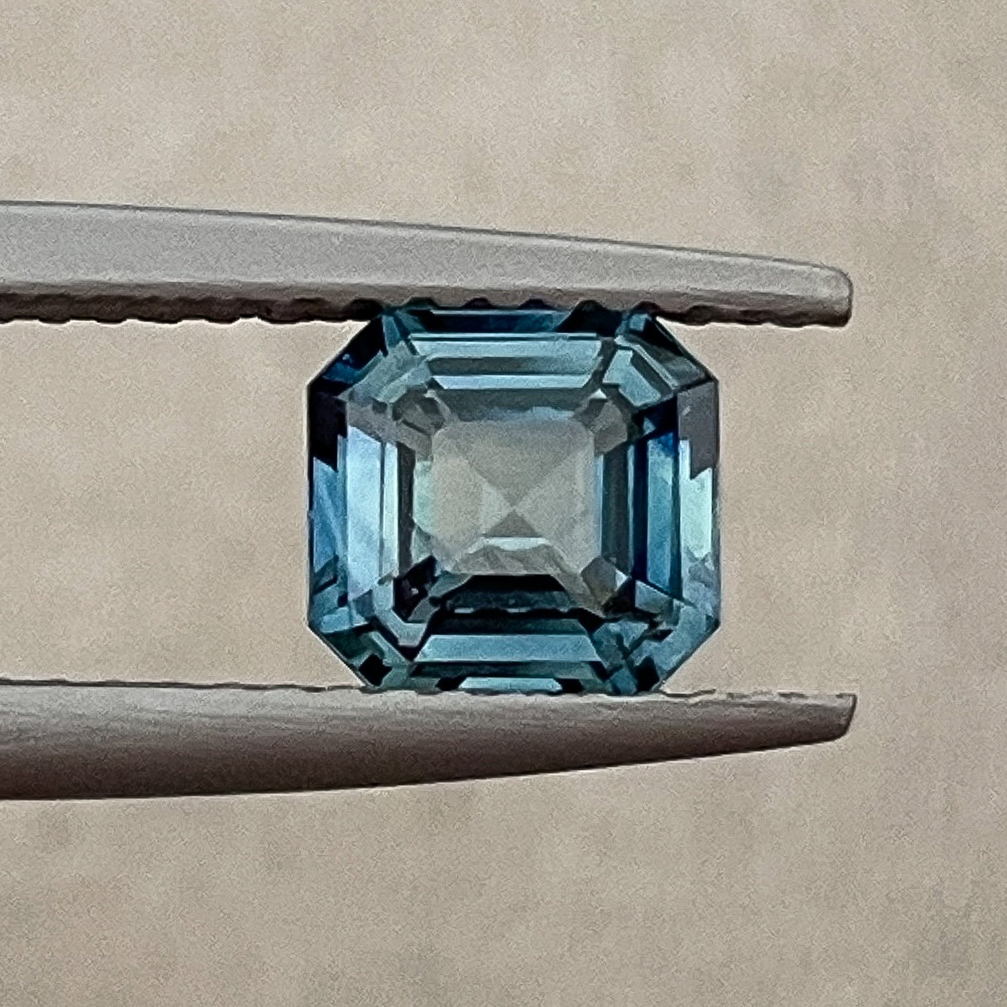 Natural teal blue sapphire 1.52 Ct emerald cut loose gemstone by NASHGEMS, ideal for engagement rings or custom jewelry.